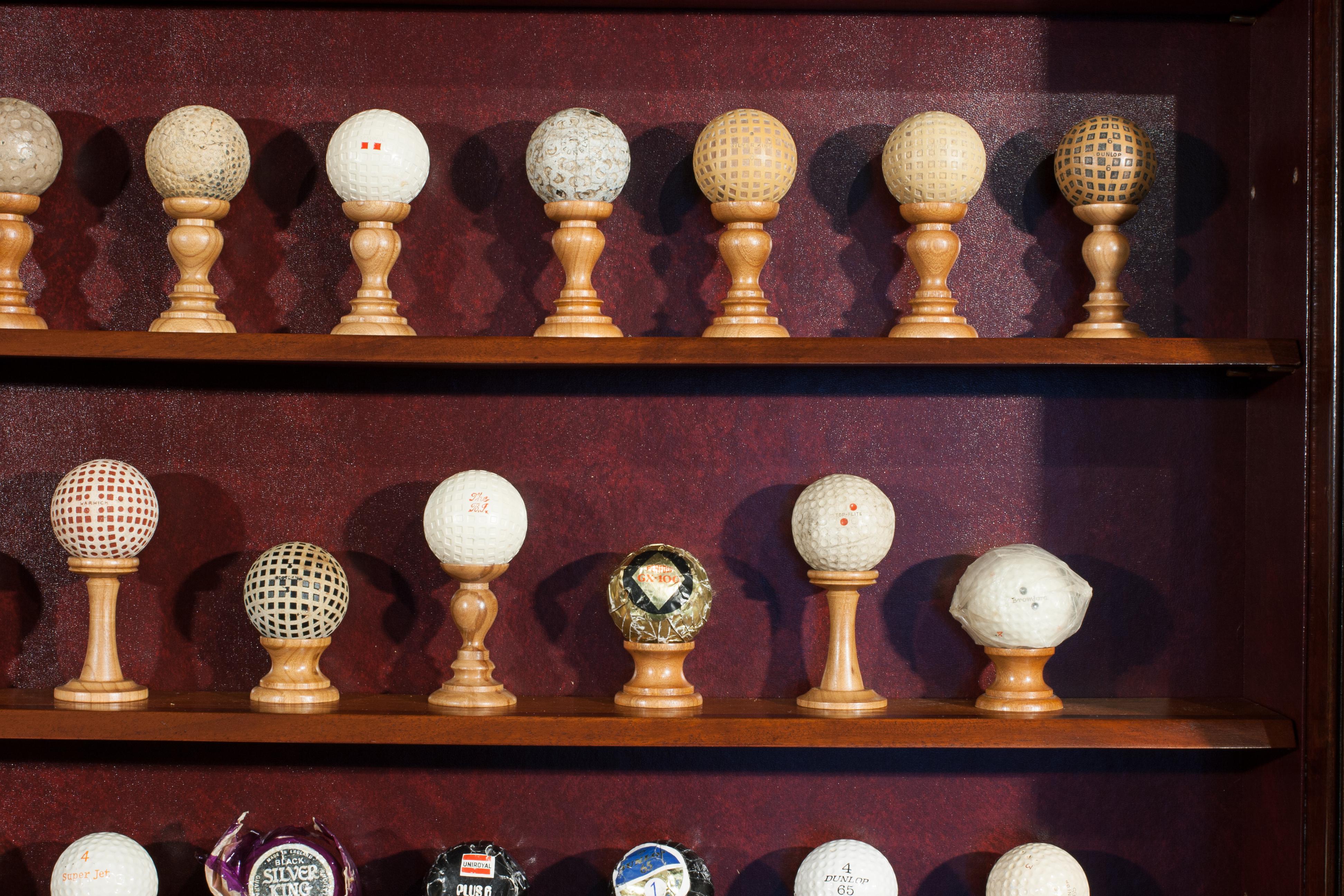 Antique Golf Ball Collection from 1890 - 1960 in Cabinet 2