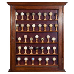 Antique Golf Ball Collection from 1890 - 1960 in Cabinet