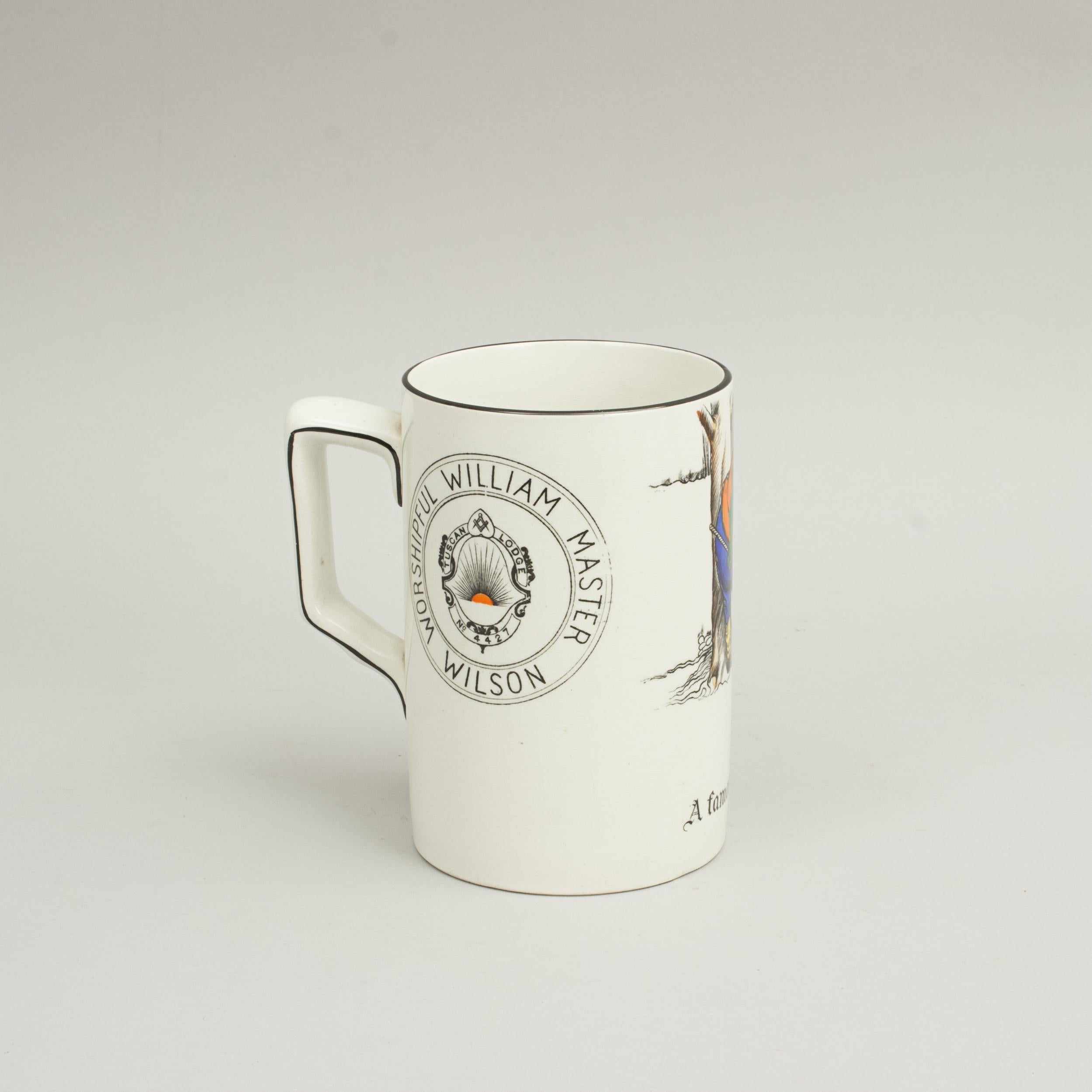Masonic / Sportsman Golf Tankard.
A white glazed ceramic tankard with golf scene and Masonic emblem. The golf scene shows an inebriated golfer lent against a tree, his club strewn across the ground, talking to his golf ball. The slogan running