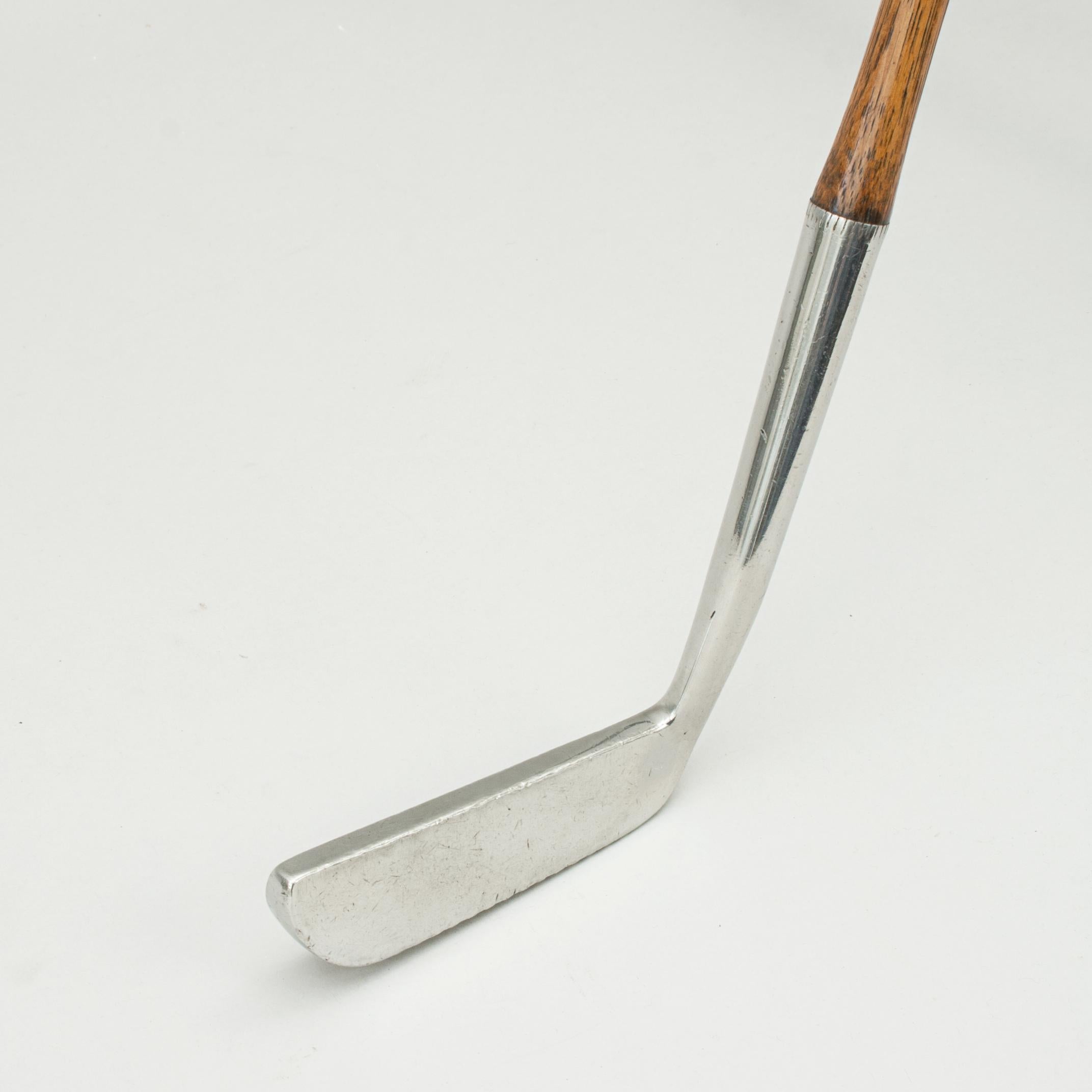 Hickory Shafted Golf Club, Benny Putter, 'Gruvsol', Ben Sayers.
A good original example of a 'Gruvsol' Benny putter made by Ben Sayers, North Berwick. The club with original square hickory shaft stamped 'B. SAYERS' with polished leather grip. It is