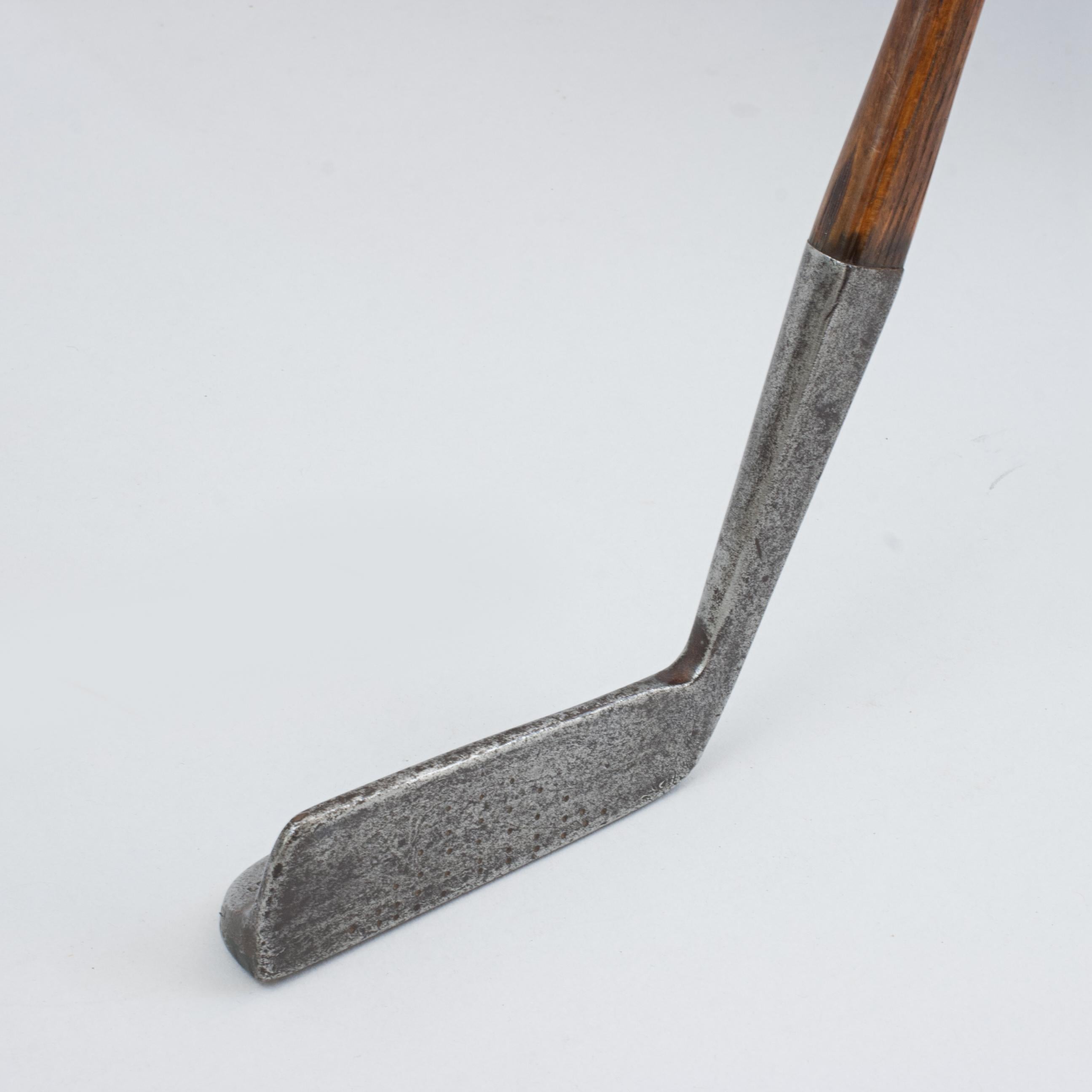 James Braid Orion Putter By William Gibson.
Hickory golf club putter by William Gibson, Fife, endorsed by five times Open Champion, James Braid. The club carries the James Braid endorsement autograph and the model name 'The Orion'. On the sole is