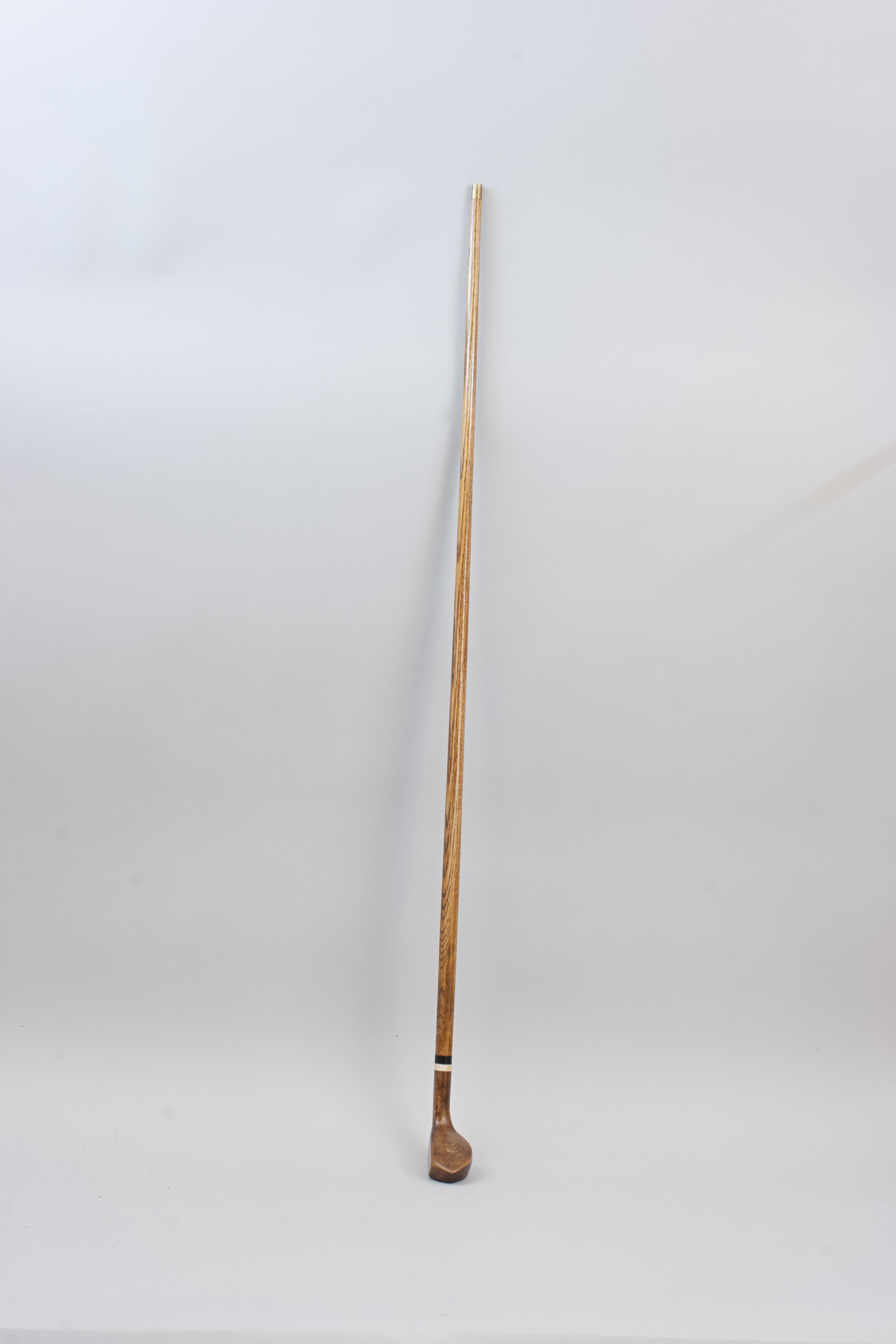 Antique Sunday Club, Golf Club Walking Stick.
A desirable walking cane with the handle in the shape of a left-handed longnose styled golf club head. The gentleman's walking stick has a persimmon socket head handle with a pegged horn insert and a