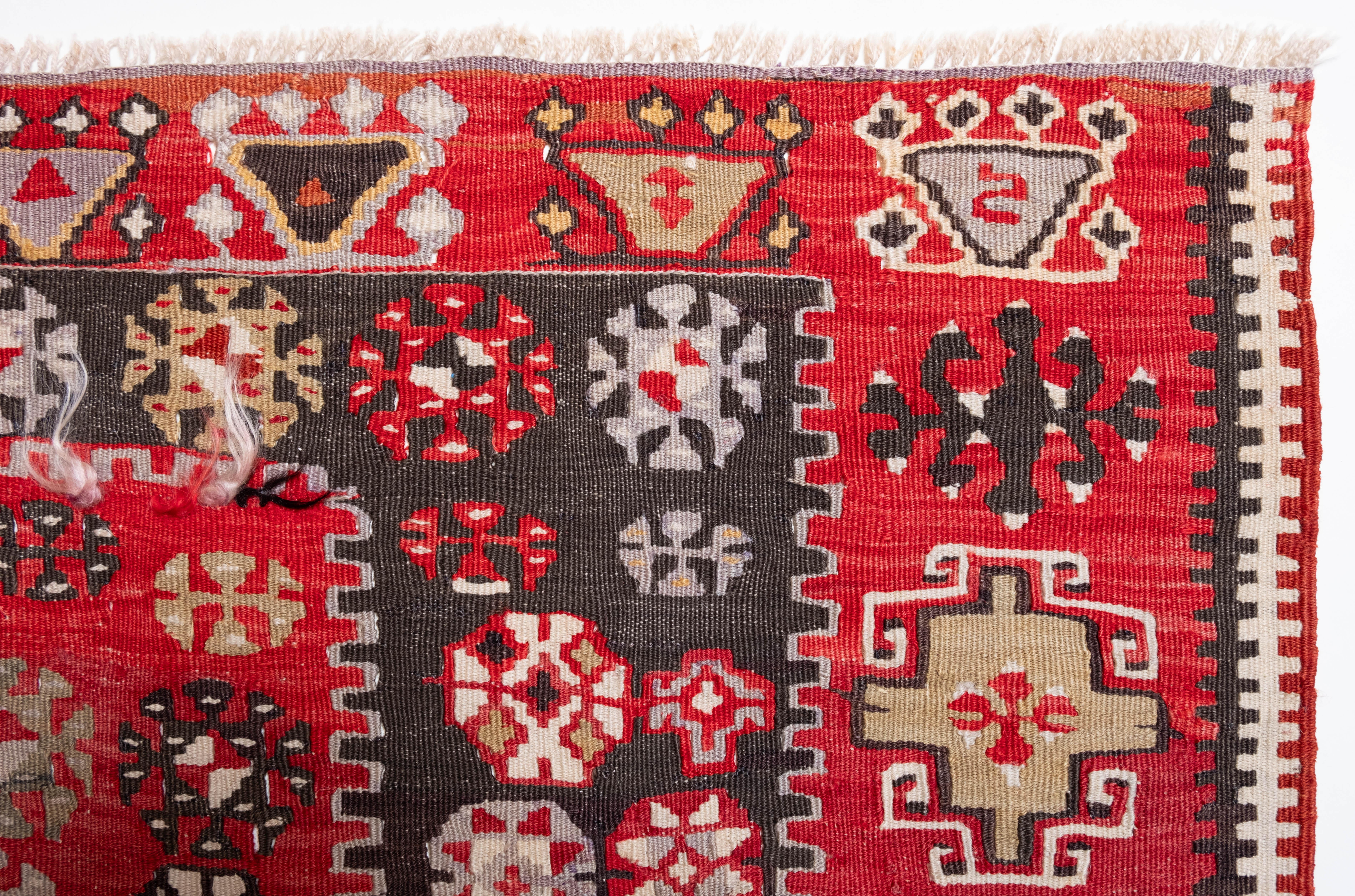 This is Central Anatolian Antique Kilim from the Gomurgen, Kayseri region with a rare and beautiful color composition.

This highly collectible antique kilim has wonderful special colors and textures that are typical of an old kilim in good