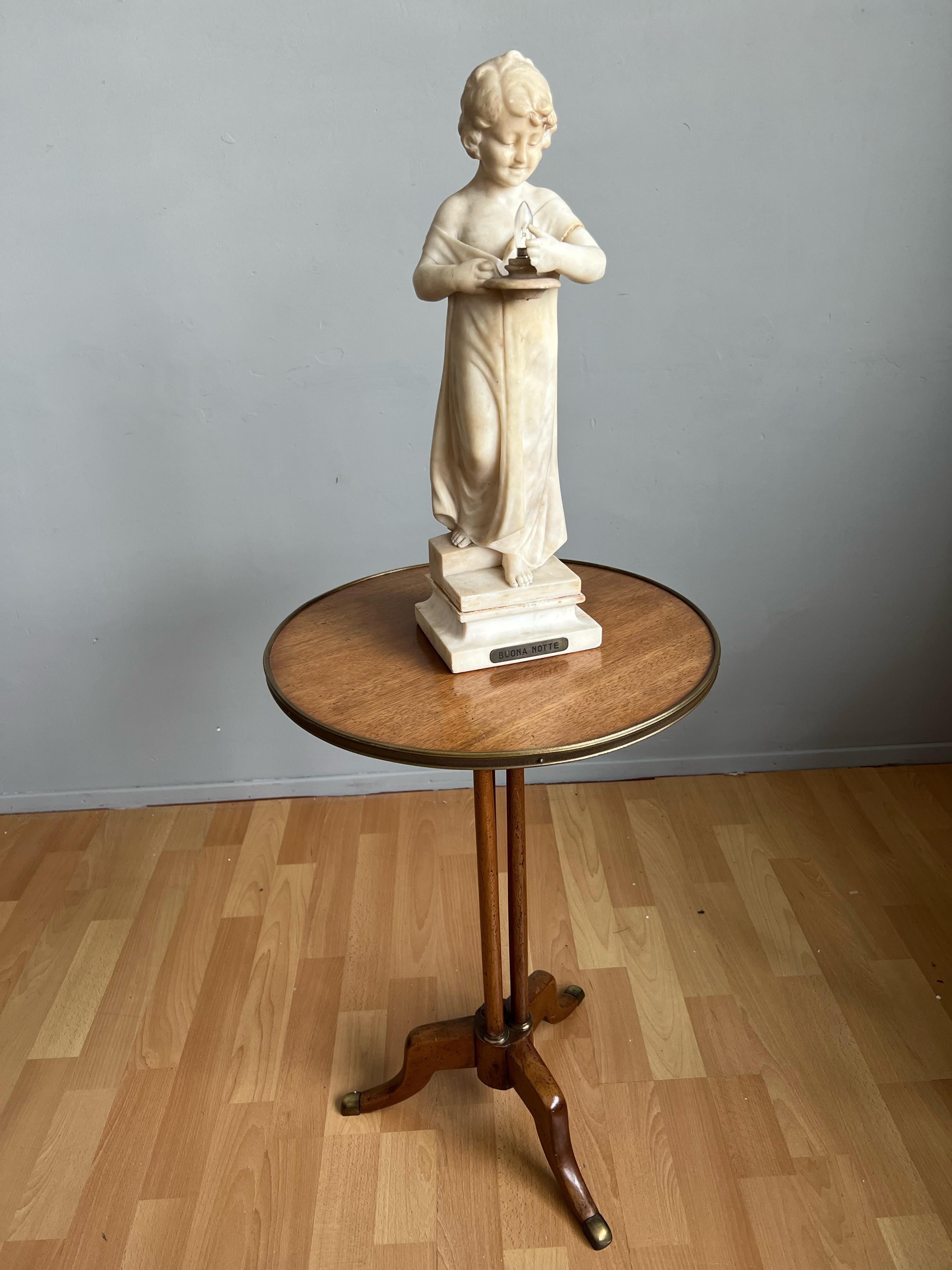 Enchanting antique sculpture of a girl on the stairs holding a light, by Umberto Stiaccini, Florence circa 1910.

This beautiful and truly elegant, sculptural table or desk lamp is another one of our recent great finds. On the front is a brass
