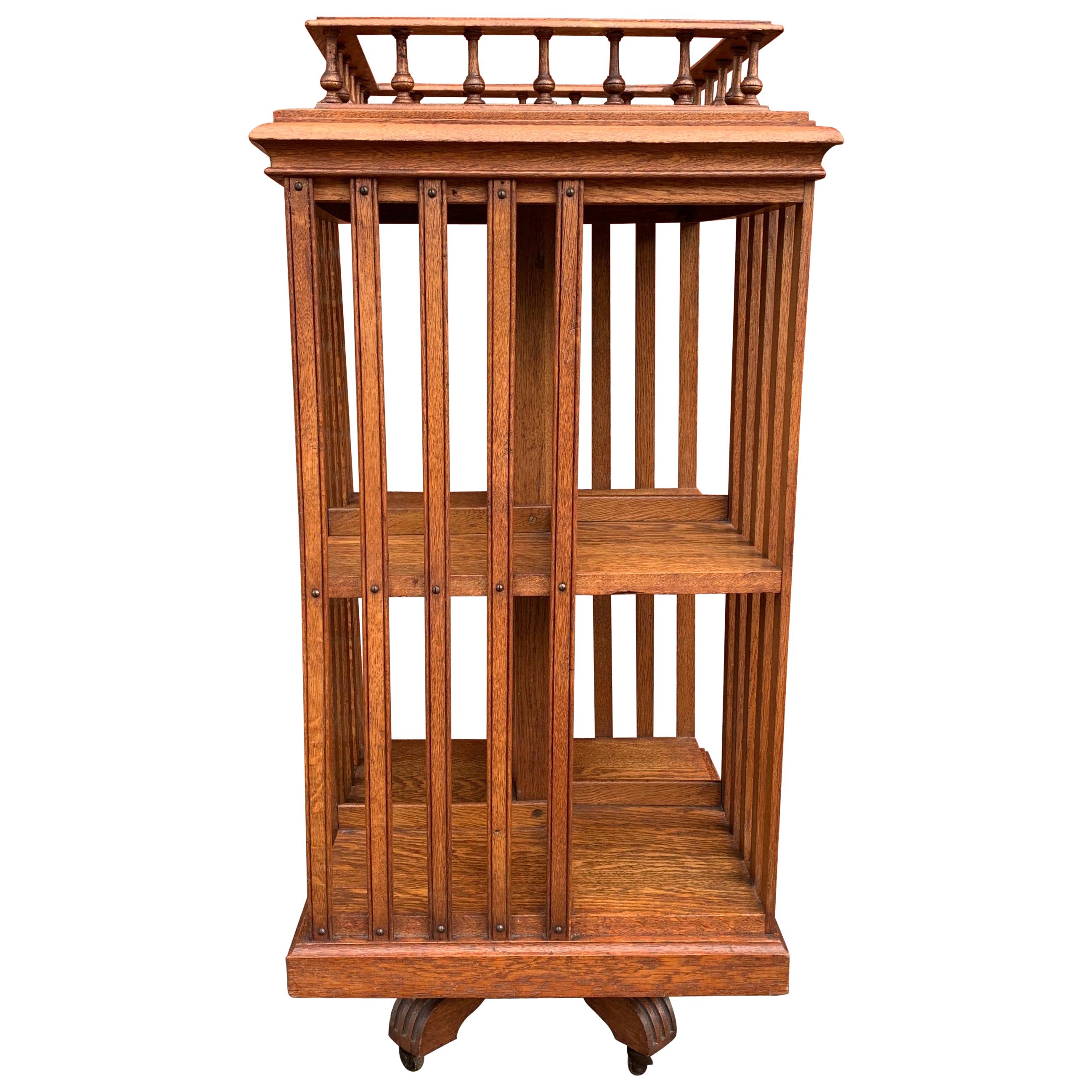 Antique & Good Size Early 1900s Tiger Oak Revolving Bookcase on Original Wheels For Sale