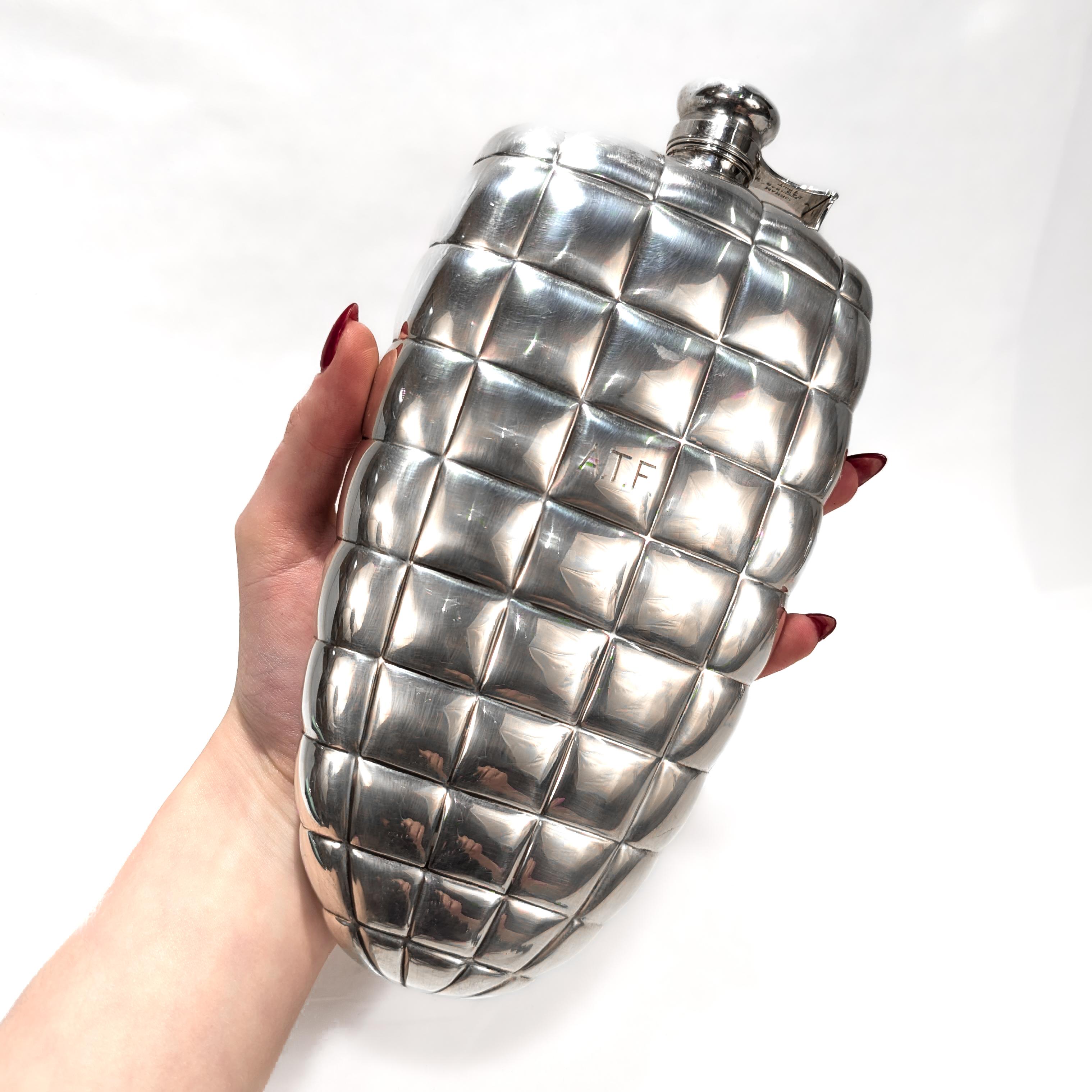A fine American Art Deco flask.

By Gorham.

In the elusive pattern often referred to as 'Quilted'. This pattern is said to mimic the design of Deco period dirigibles or blimps. 

By repute, the actor Clark Gable's favorite flask was a smaller