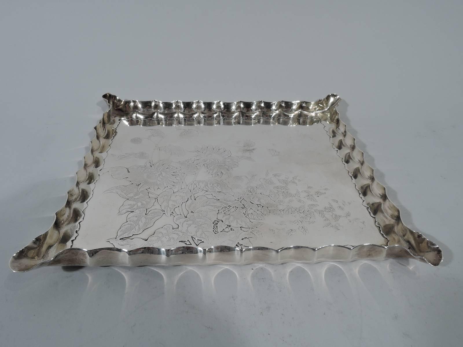 Japonesque sterling silver tray. Made by Gorham in Providence, ca 1885. Rectangular with applied irregular and wavy border and crimped rim. Well engraved with profusion of flowers. Hallmark includes no. 5. Weight: 9.8 troy ounces.  
