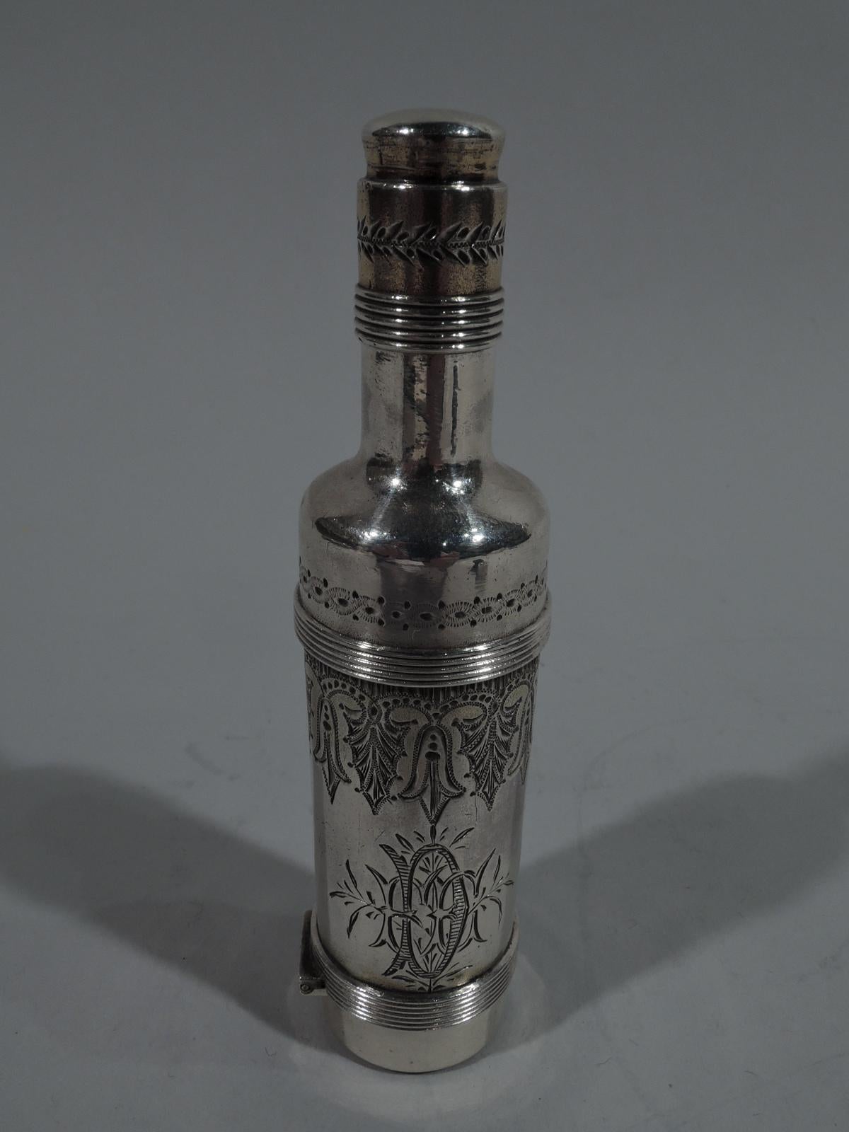 Beautiful gift-quality sterling silver perfume bottle. Made by Gorham in Providence in 1873. Cylindrical with sloping shoulder and tall neck. Threaded and cork-lined cover. At bottom viniagrette with hinged cover and hinged and pierced grill.