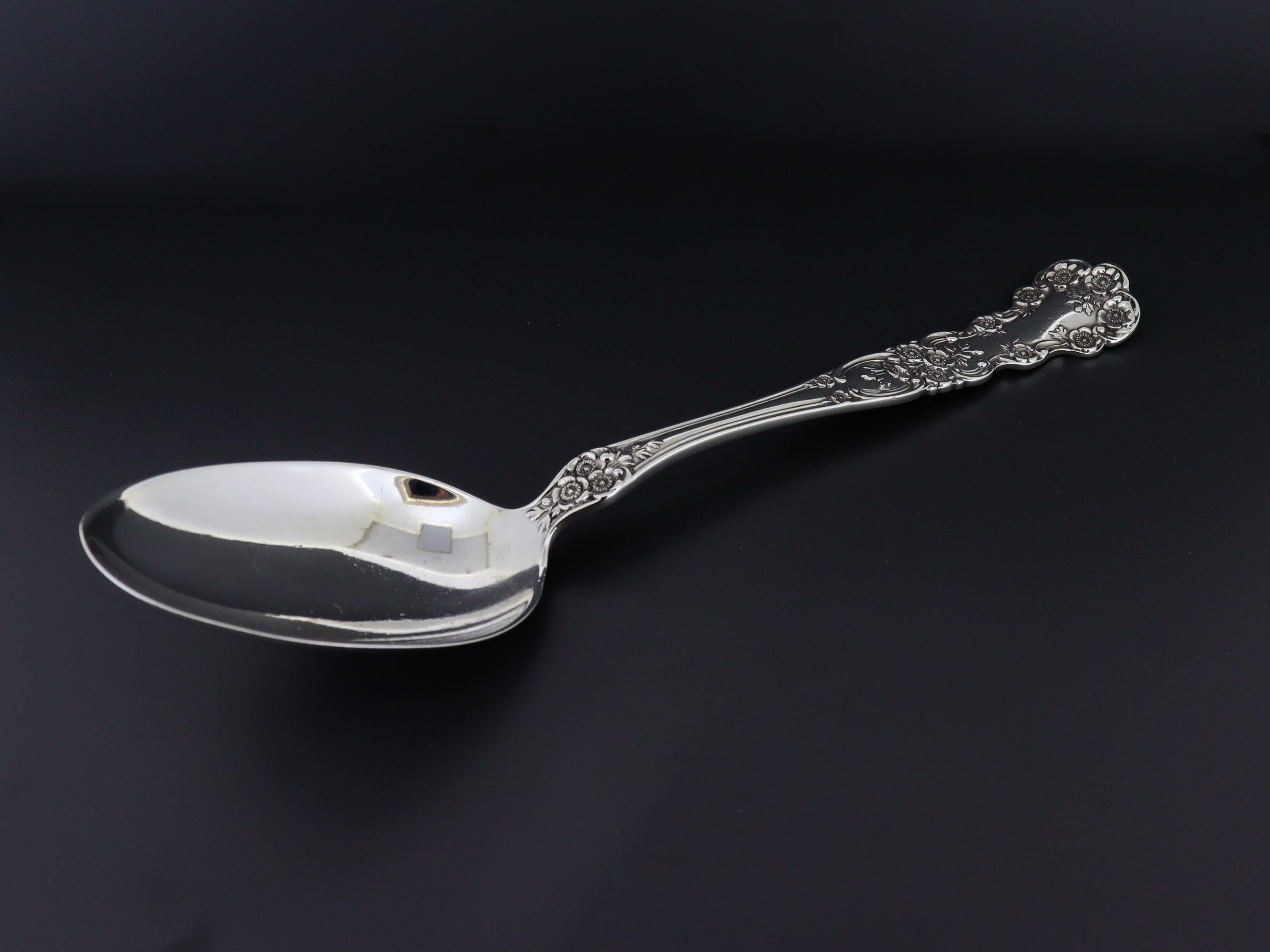 A very fine antique American silver table spoon.

By Gorham.

In sterling silver.

In the Buttercup pattern. 

In a hard to find 6 7/8 in. size.

Marked with the E in Diamond mark indicating the special extra heavier weight or gauge in comparison