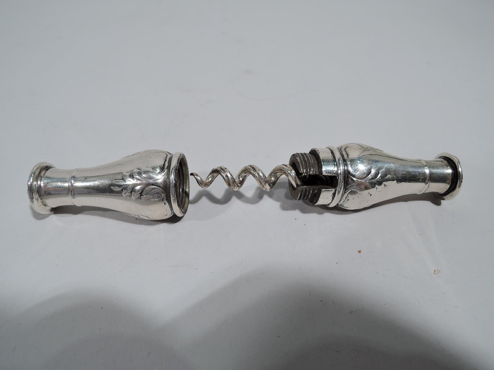 Edwardian Regency sterling silver corkscrew. Made by Gorham in Providence, ca 1910. Double baluster with raised pendant leaf ornament; raised paterae at ends. Cover threaded. Twist lock ensures a confident and successful tug. Handy purse size. Come