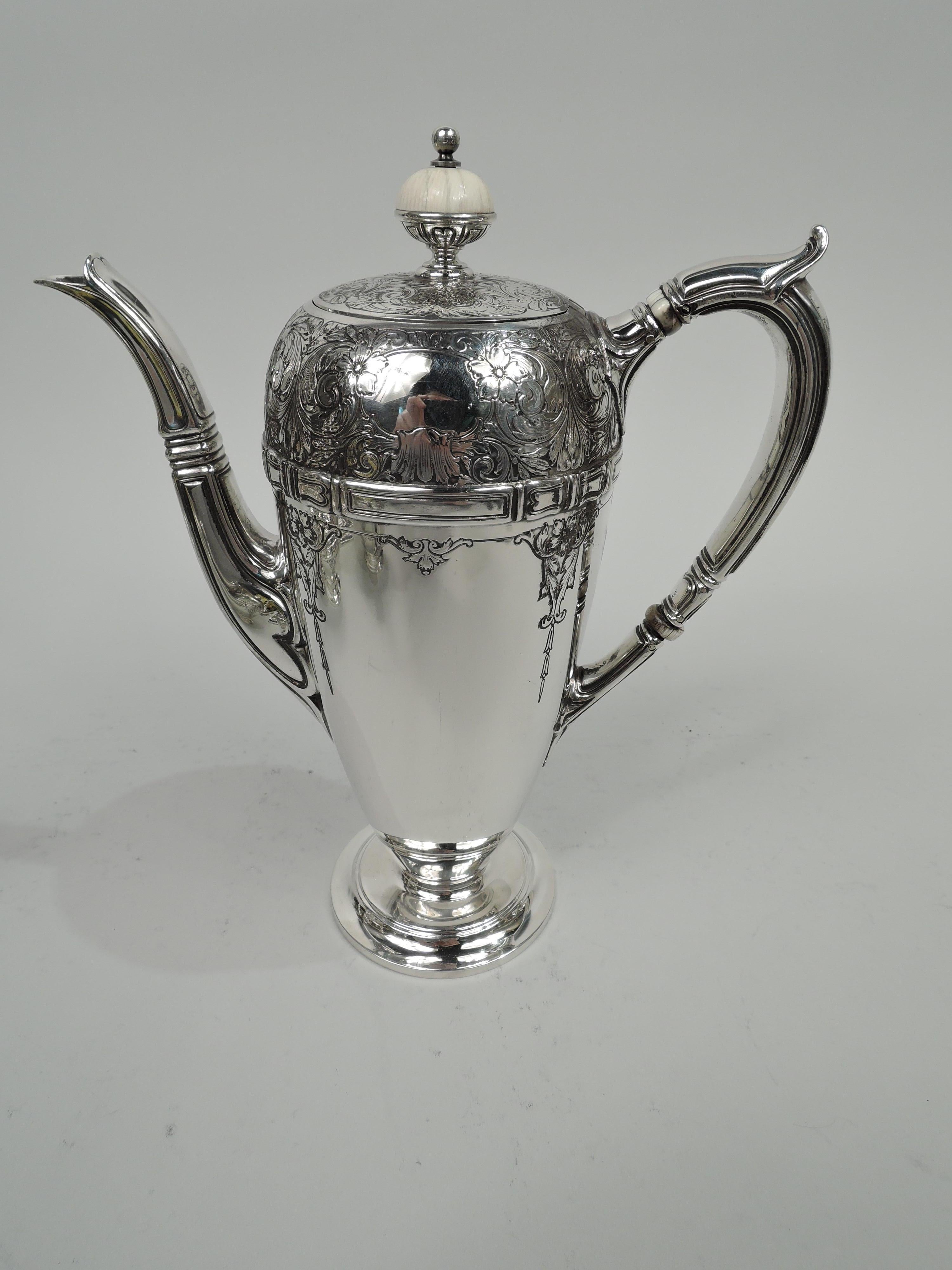 Edwardian sterling silver 3-piece coffee set. Made by Gorham in Providence, ca 1917-8. This set comprises coffeepot, creamer, and sugar. Coffeepot has tapering ovoid body with flush and hinged cover and s-spout with tooled curvilinear frames and