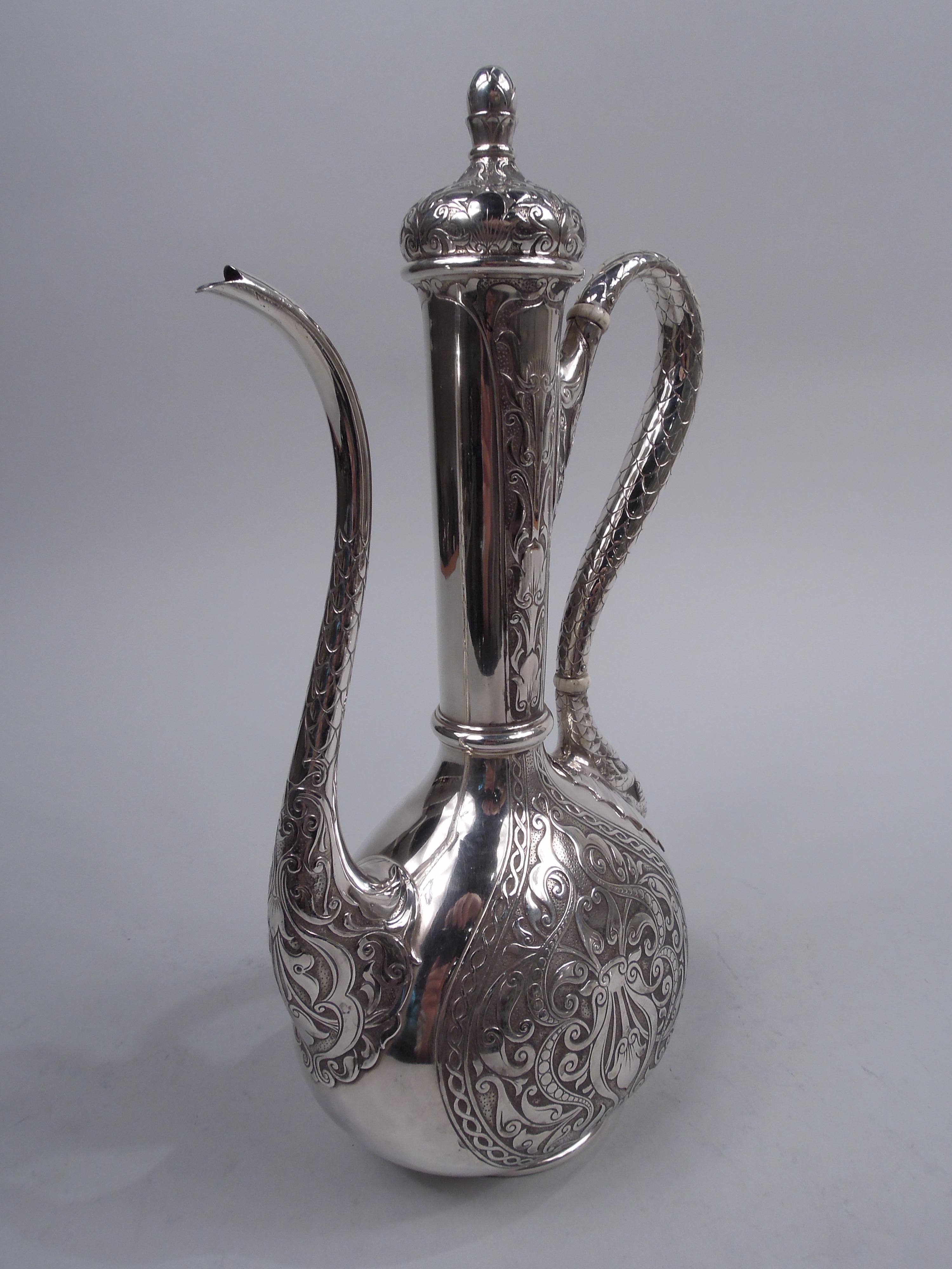 Fin-de-siecle exotic Turkish sterling silver coffeepot. Made by Gorham in Providence in 1900. Narrow ovoid bowl with cylindrical neck and round inset foot. High-looping snake scale handle; s-scroll spout same as is ball finial on hinged and domed