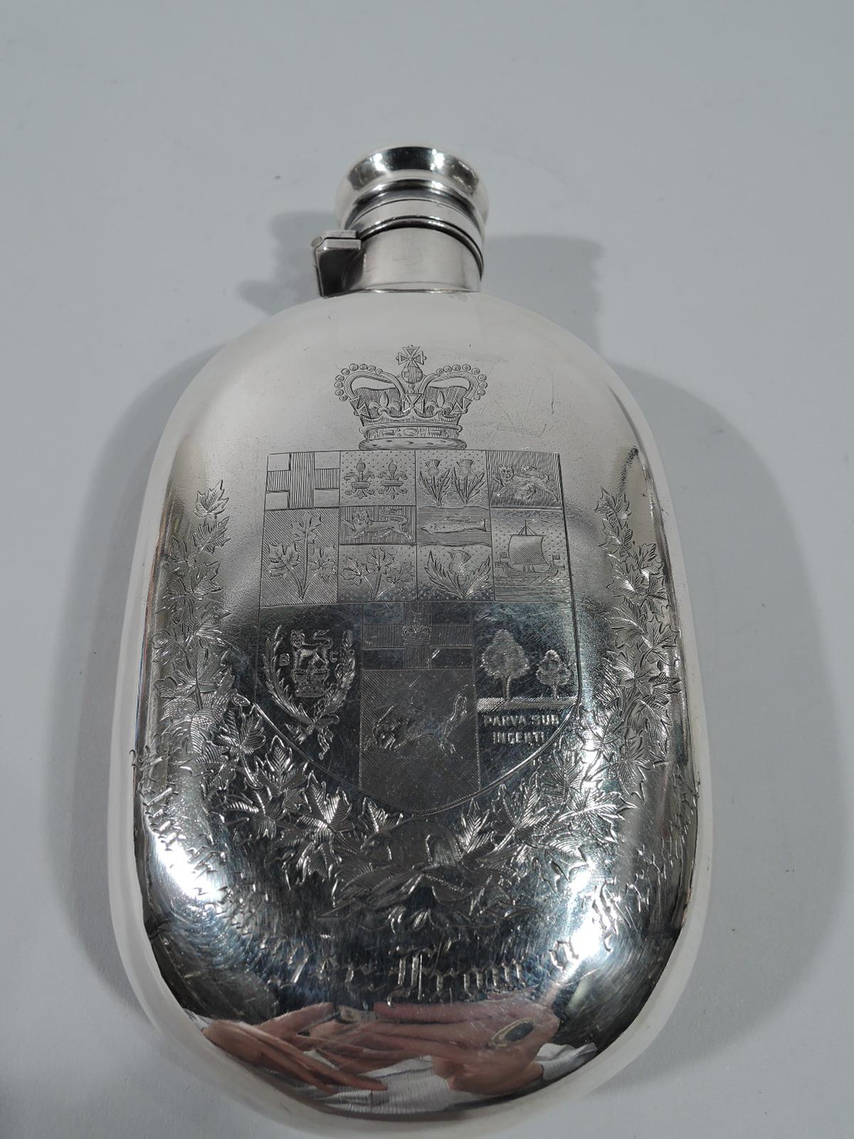 Japonesque parcel-gilt sterling silver flask. Made by Gorham in Providence in 1884. Curved body with short neck and hinged and cork-lined cover. On front is chased pear branch with gilt fruit on stippled ground. On back is engraved armorial with