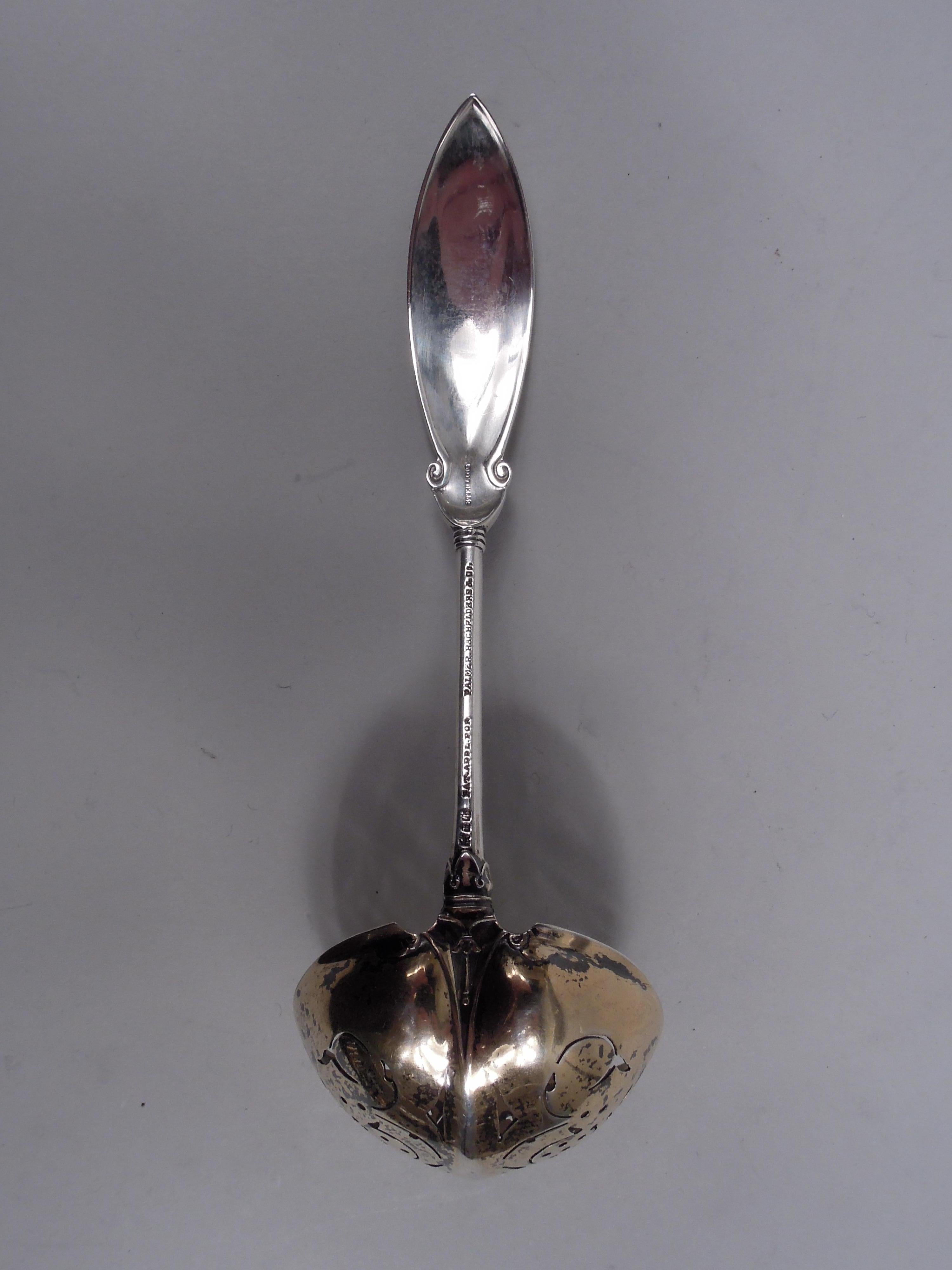Persian sterling silver pierced ladle. Made by Gorham in Providence, ca 1871. Pointed ovoid terminal with stylized leaf and scroll ornament mounted to round stem with reeded bands set in leaf mount; bowl round and gilt with ornamental piercing and