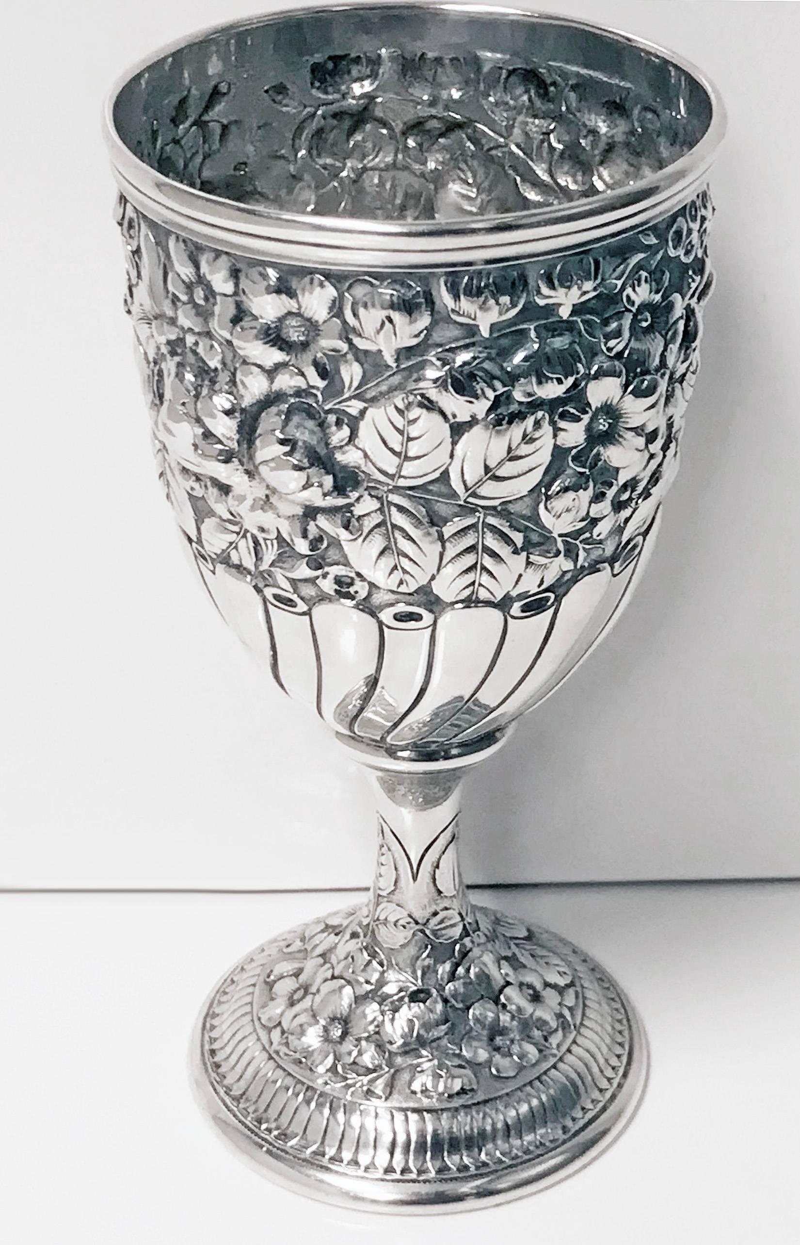 Antique Gorham sterling goblet, circa 1890. The goblet on pedestal base, all richly decorated with embossed repousee chased and engraved foliage decoration. The lower part of vase shape with lobate panel surround, four of which are beautifully