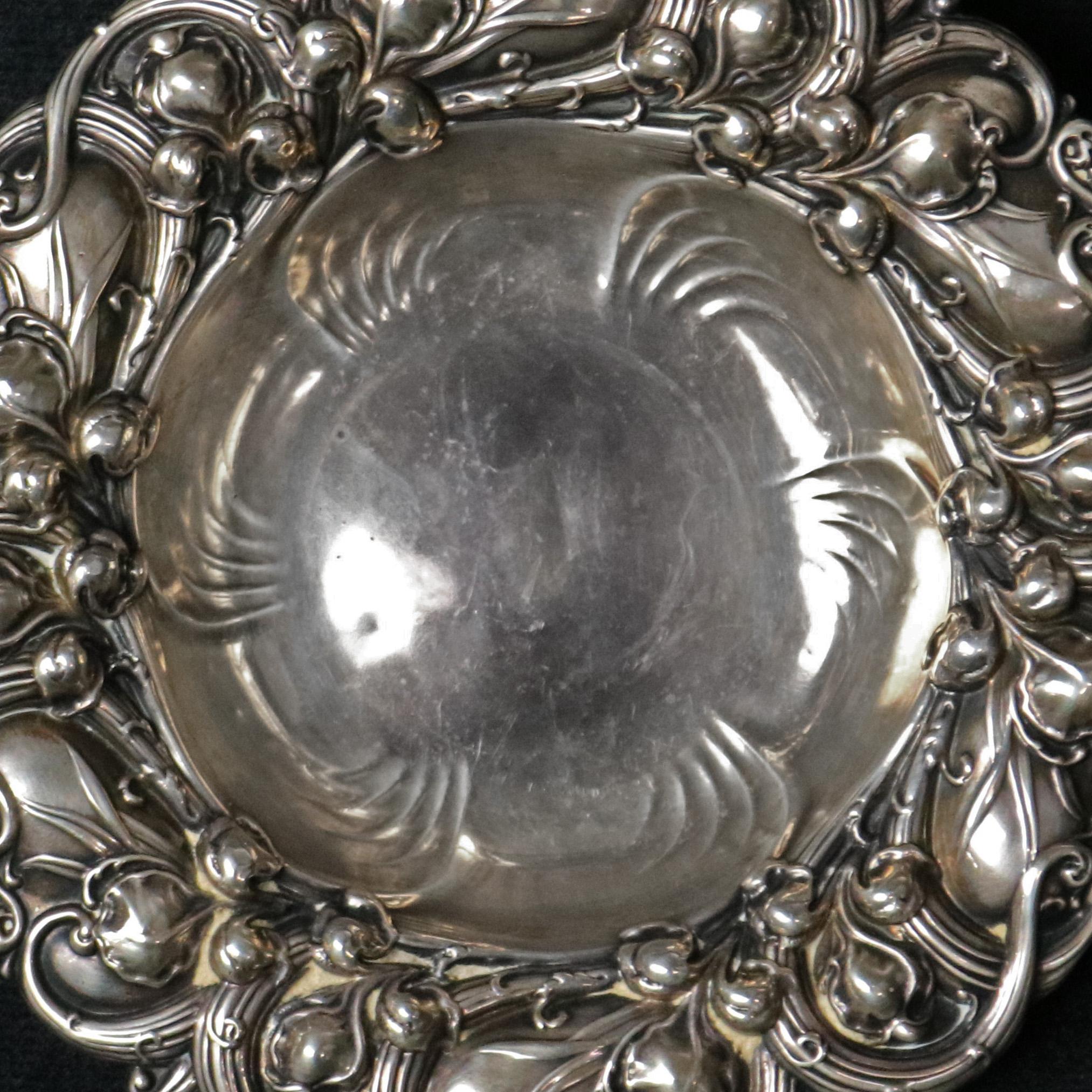 An antique sterling silver nut bowl by Gorham offers repousse leaf and vine rim, en verso mark, circa 1890

Measures: 1