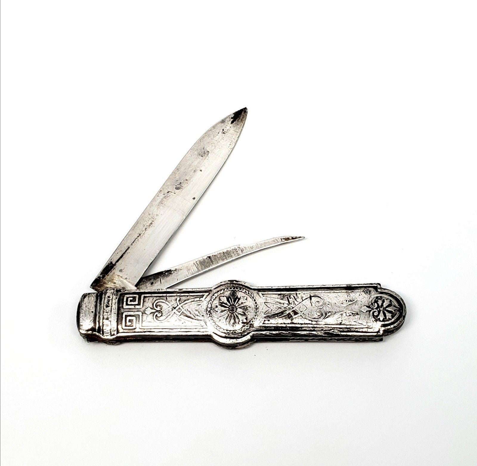Gorham sterling silver pocket knife with straight blade and nut pick. No monogram. Measures approx 3 1/8