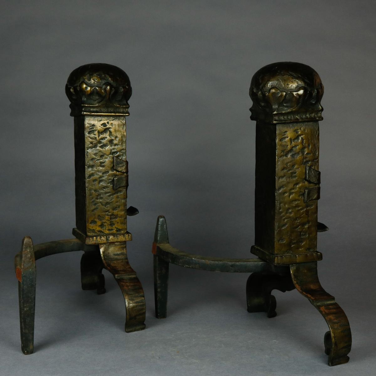 A set of antique Gothic Bradley and Hubbard School brass fireplace andirons offer hammered brass in tower form with central shield and oversized ball finial raised on scroll form feet, without firedogs, 19th century

***DELIVERY NOTICE – Due to