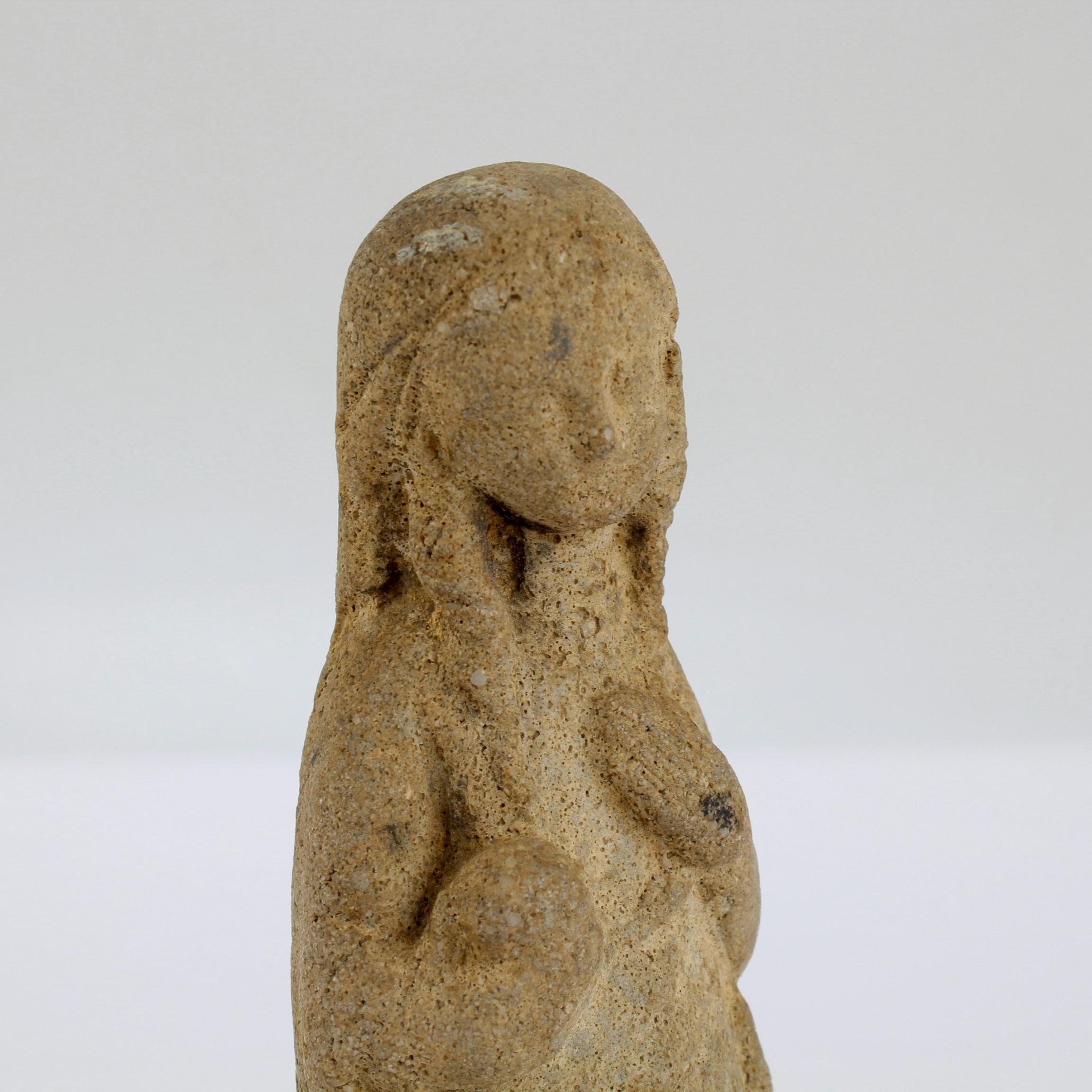 carved limestone figure