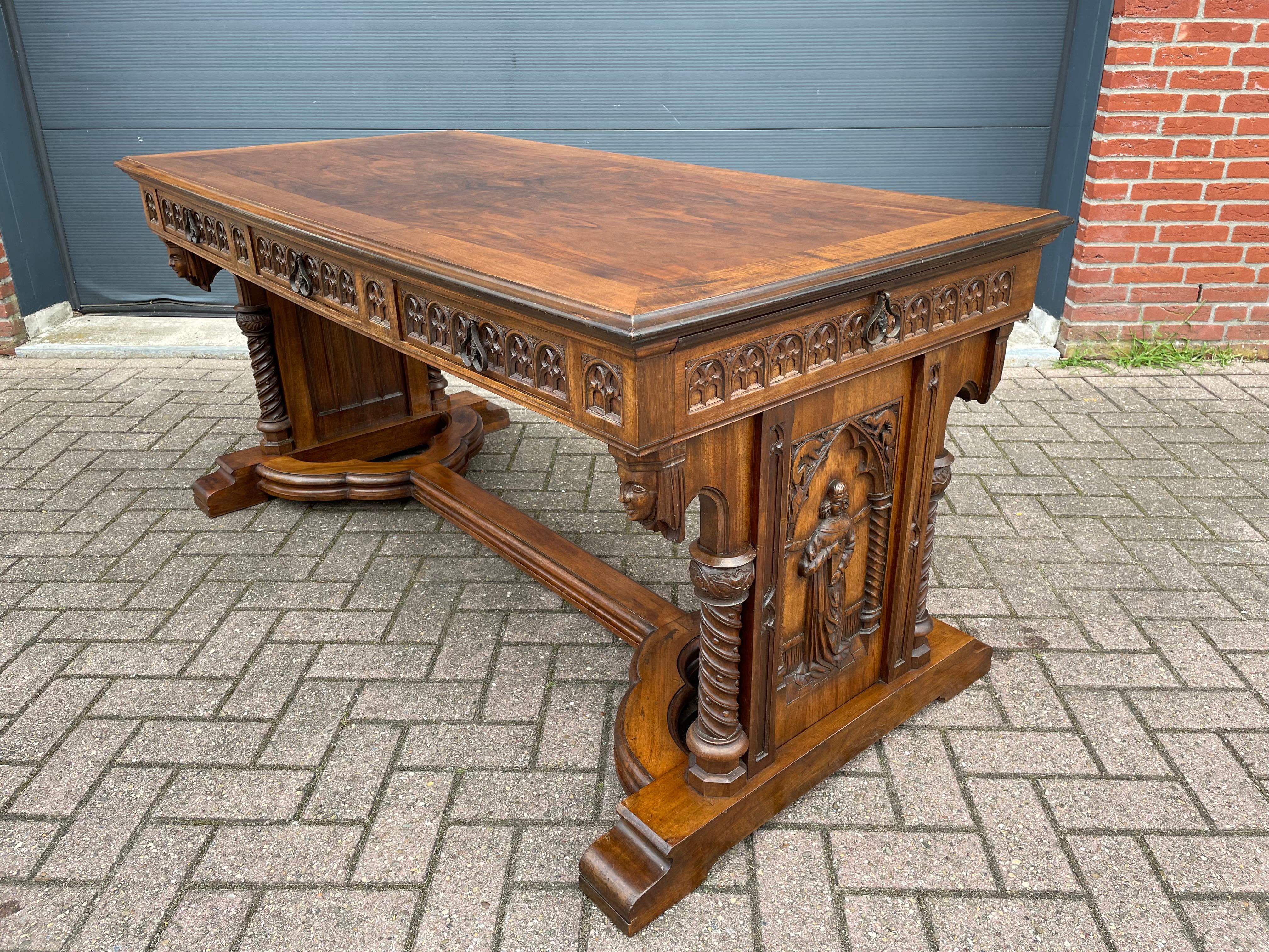 Unique early 1900s, solid nutwood, Gothic Revival writing table.

If you are a collector of unique, great looking and practical to use Gothic antiques then this striking desk could be flying your way soon. This antique writing table has the most