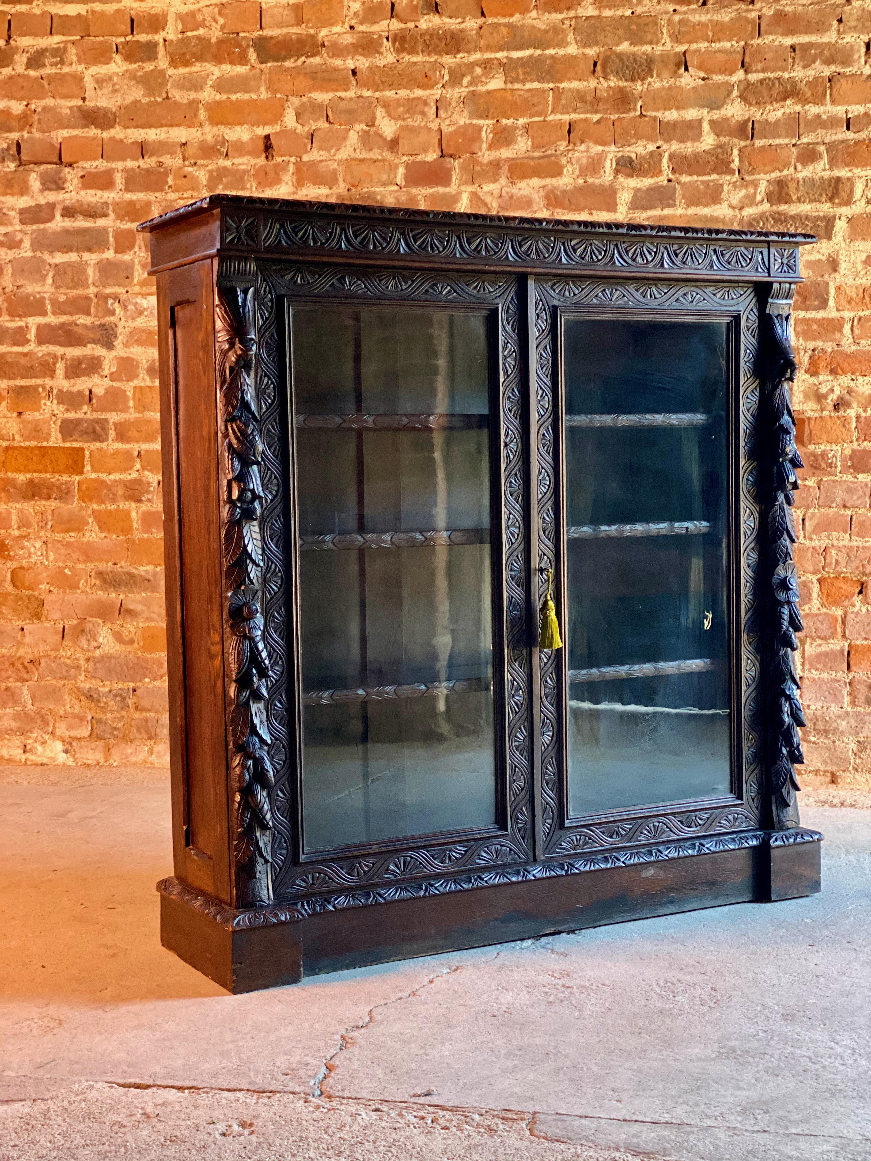 Antique Gothic Green Man oak bookcase Victorian glazed circa 1870 3


Magnificent continental 19th century oak bookcase or display cabinet in the Gothic manner dating to France circa 1870, the rectangular overhanging top with beautiful profusely