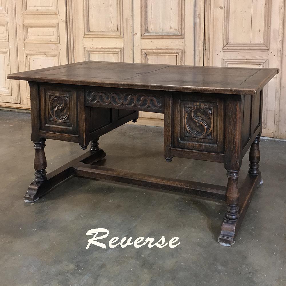 Antique Gothic oak desk with leather top is atypical for the style, being raised up on turned legs and a classic 