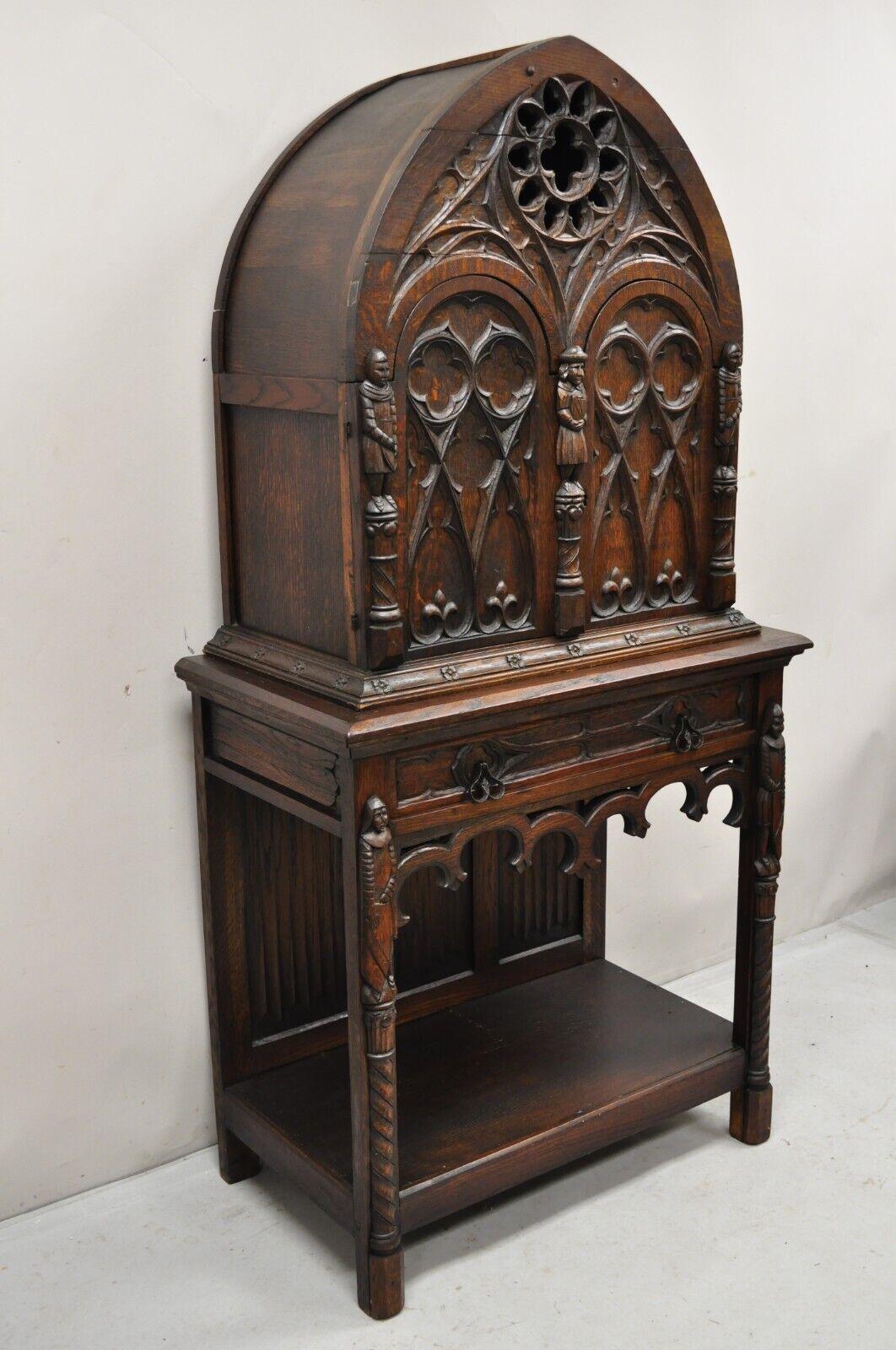 Antique Gothic Renaissance Revival Figural Carved Oak Wood China Wine Cabinet Cupboard. Item features  2 part construction, rear entry with 2 doors, one drawer, lower shelf, carved figures to door fronts and lower sides, pointed dome top, beautiful