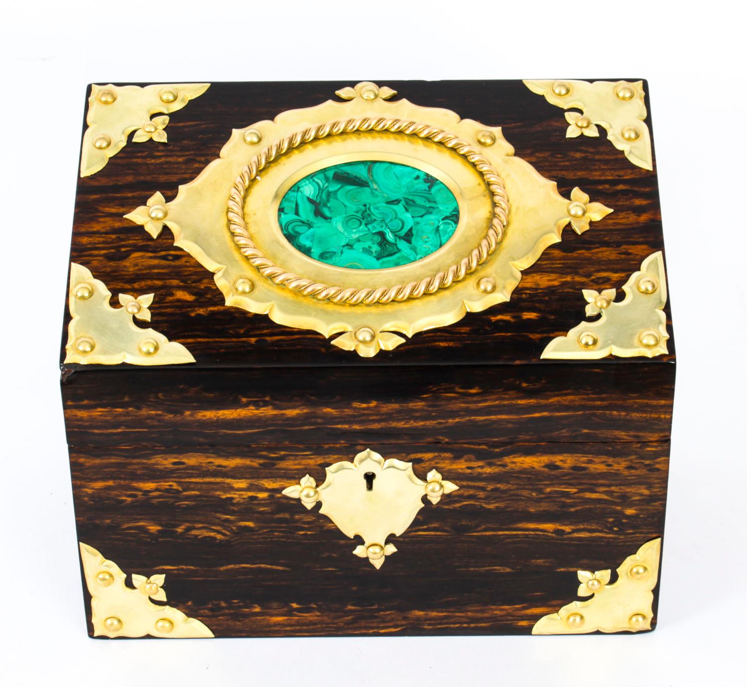 This is a stunning antique Victorian Gothic Revival coromandel stationery box casket, circa 1840 in date.
 
Elaborately decorated with gilt brass mounts and an attractive malachite oval set within a brass cartouche with rope twist surmount.
