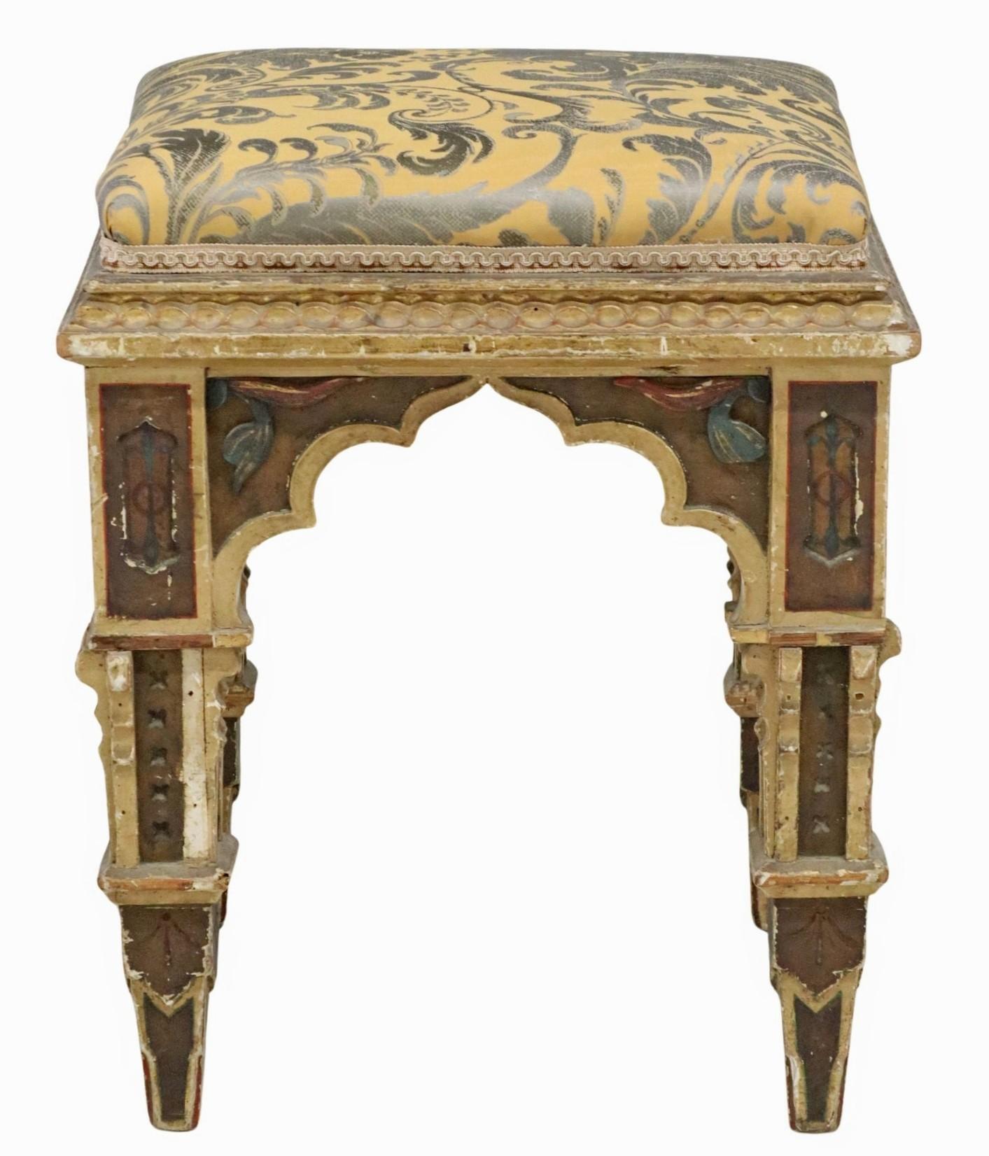 A magnificent Neo-Gothic tabouret stool / ottoman, 19th century, most likely Italian (Southern Italy; Kingdom of Two Sicilies), parcel gilt and polychrome painted frame, padded seat in later upholstery, on tapering square legs. 

Provenance /