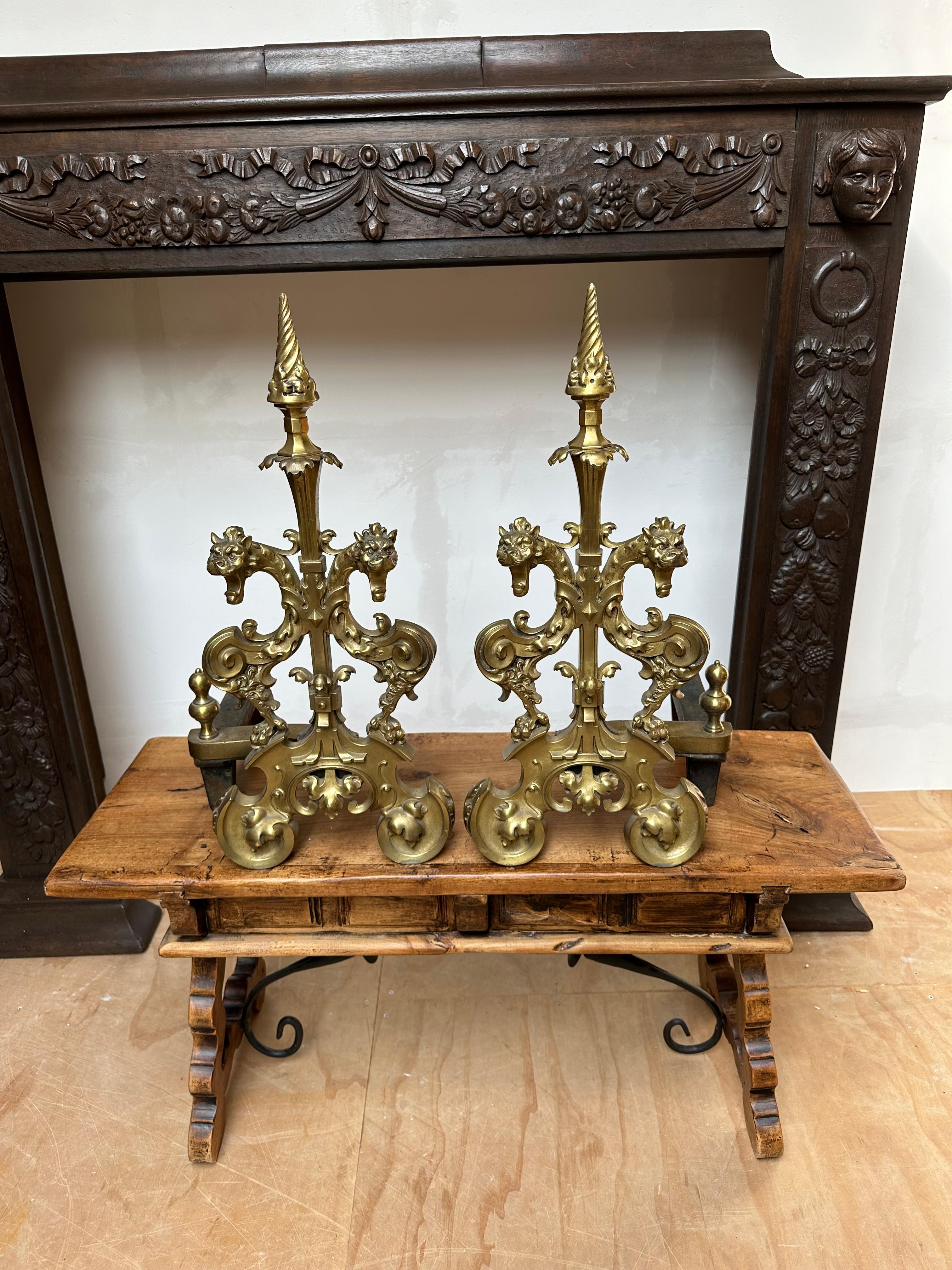 Imagine these in your fireplace with the flames burning on all sides.

These beautifully and all handcrafted, large and fire-gilt bronze andirons are made to stand in your fireplace as in image number one, but then facing straight forward. The idea