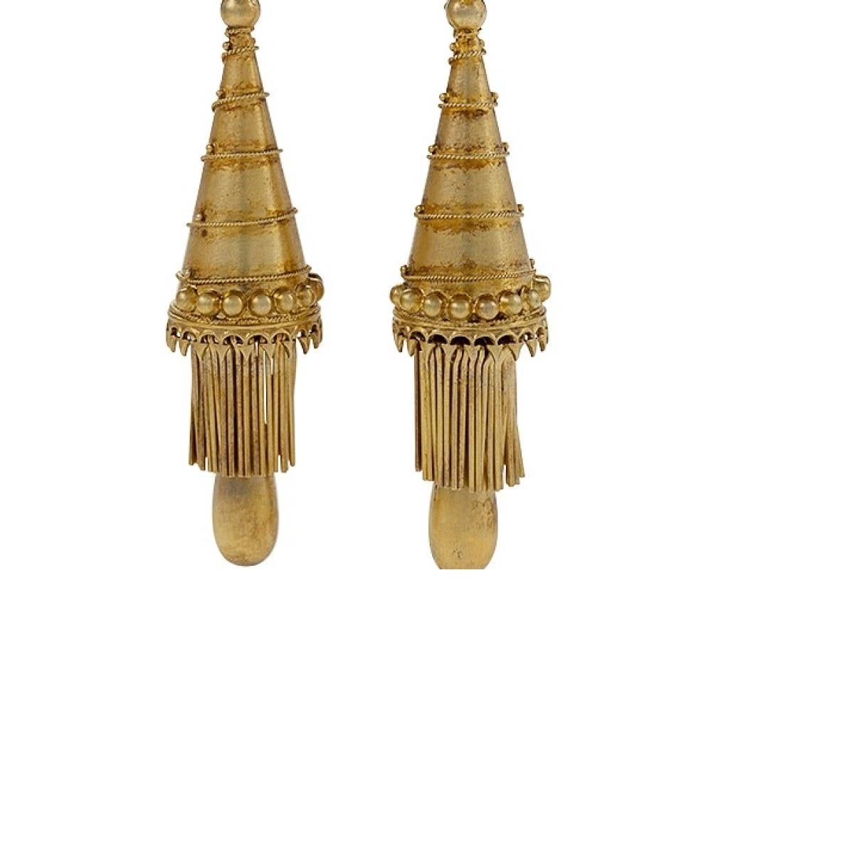 A pair of Antique 15 karat gold earrings.  The articulated earrings are designed in Gothic Revival motif as an inverted cone with fringe and drop.  The earrings are additionally decorated with twisted wire and bead work.  Circa:  Mid-19th