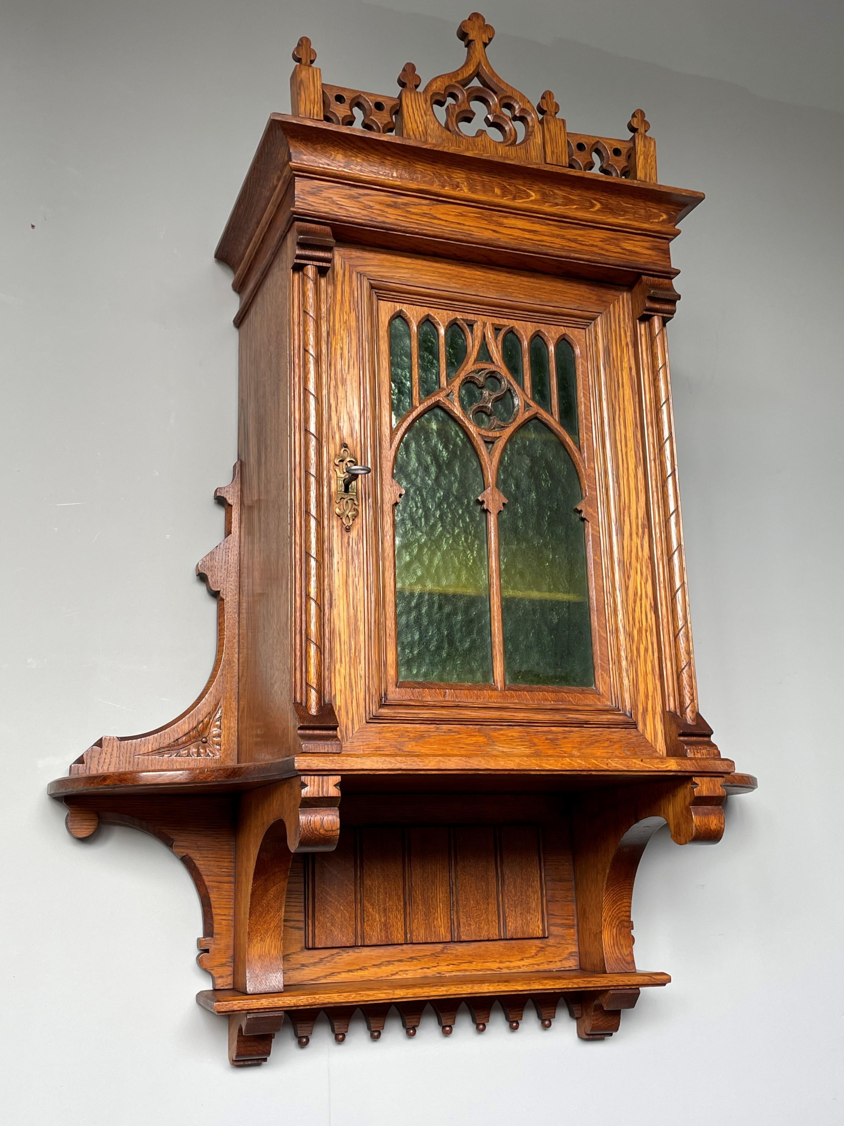 Unique and striking Gothic Revival wall cabinet with perfect working lock and key.

This handcrafted and probably unique Gothic Revival wall cabinet from the late 1800s is another one of our magnificent recent finds. The size, the quality in the