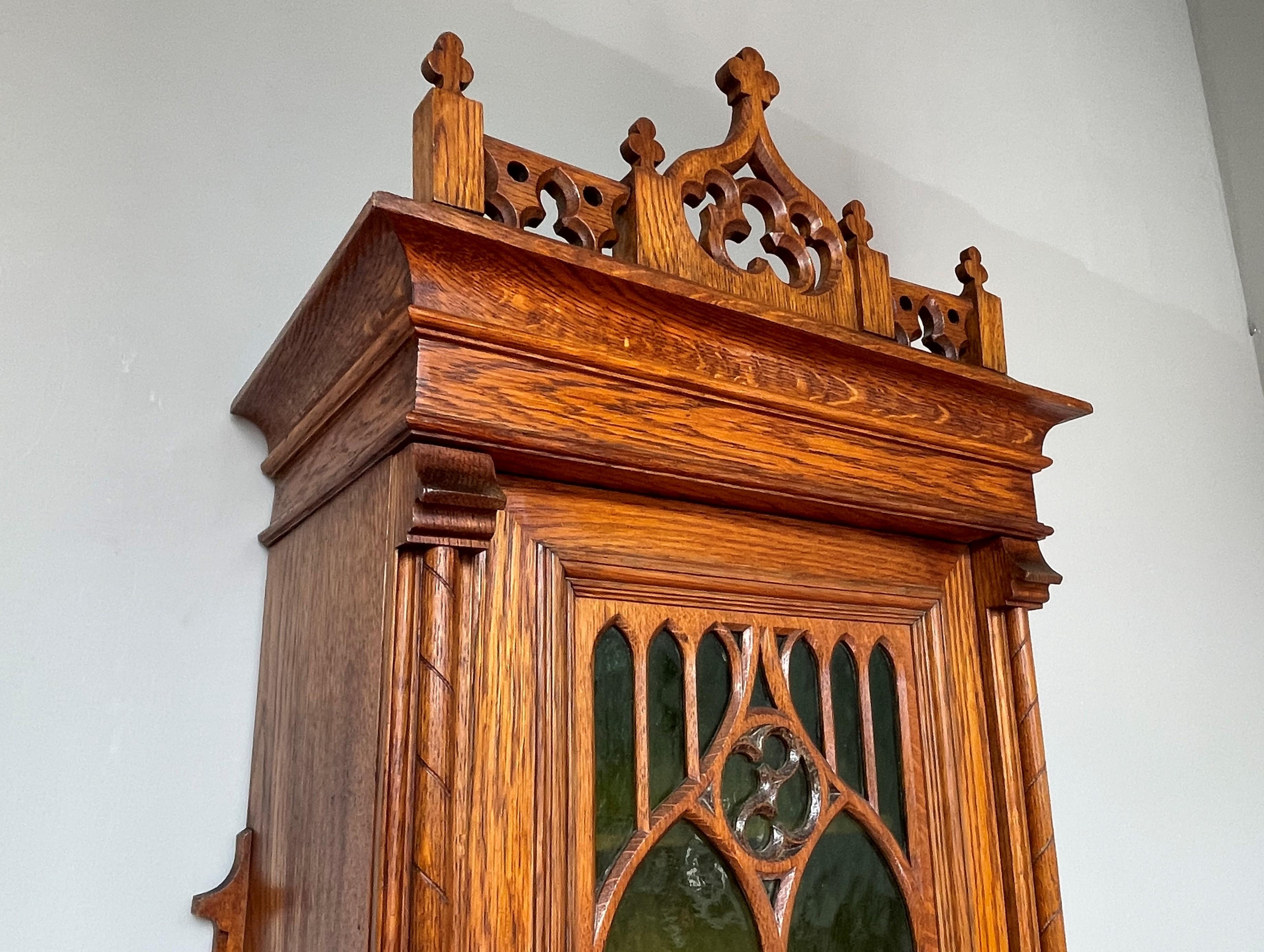 European Antique Gothic Revival Hand Carved Oak Wall Cabinet with Green Cathedral Glass For Sale
