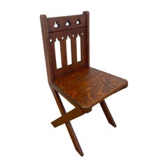 Antique Gothic Revival Oak X-Frame Accent Chair.