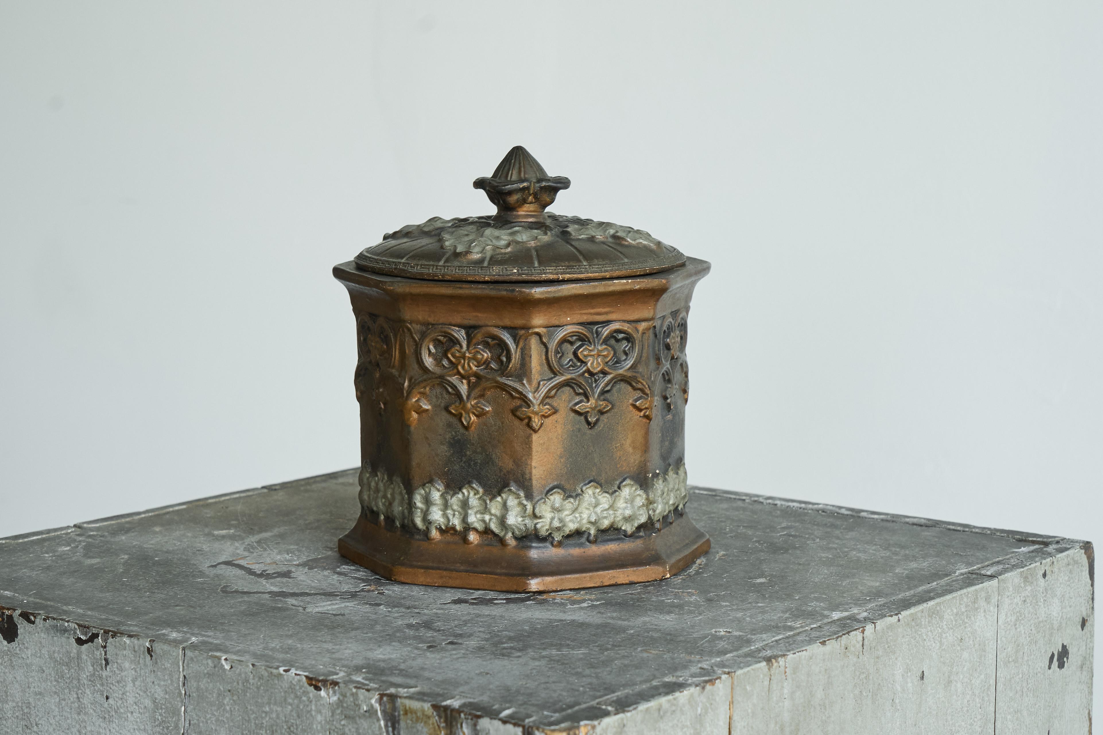 Antique Gothic Revival Lidded Tobacco Pot 19th Century.

This is a wonderful and very decorative antique tobacco pot or lidded pot, made in the late 19th century in a very distinct gothic revival style. Looks almost like a miniature chapel or some