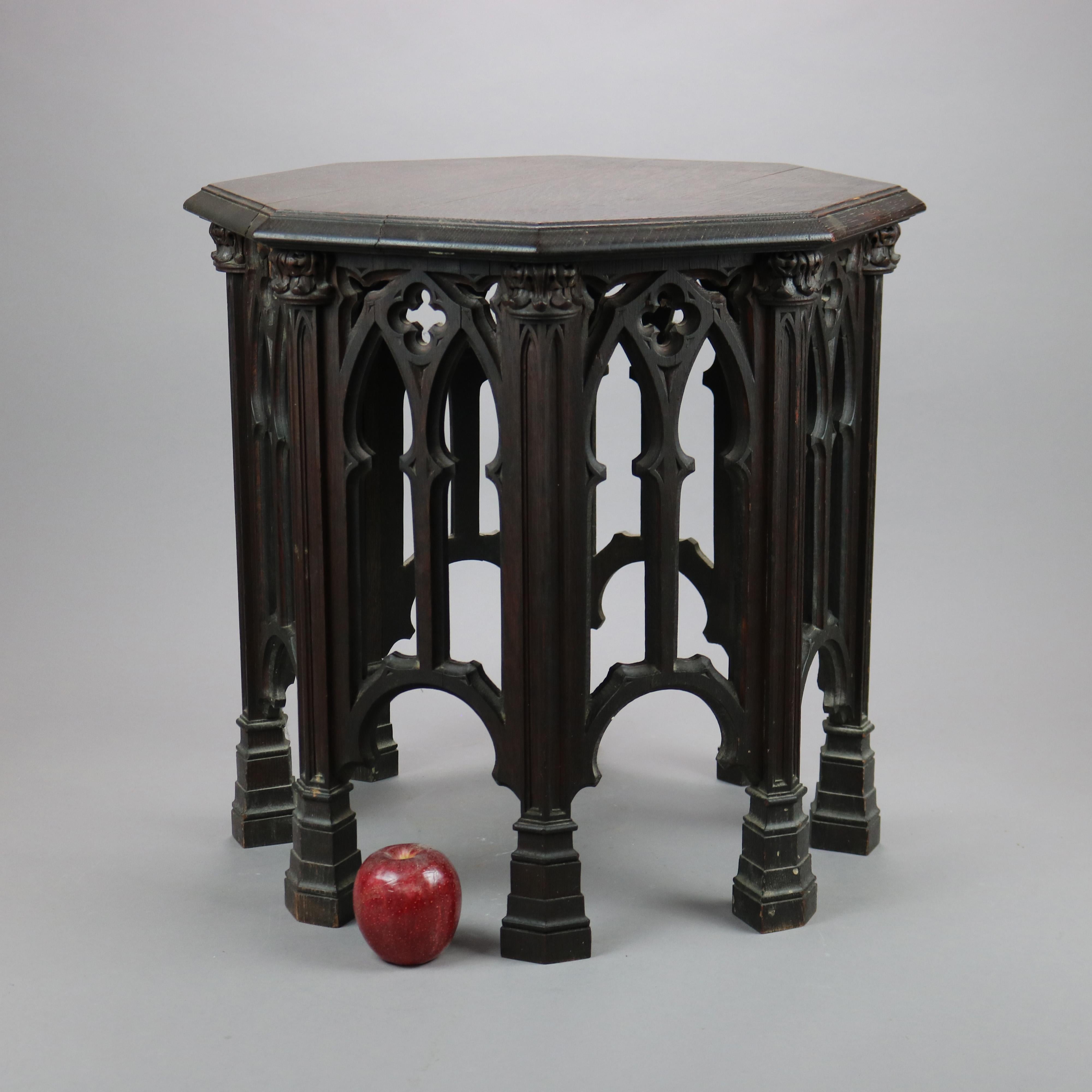 An antique Gothic tabouret Stand offers English oak construction with beveled octagonal top over pieced cathedral form sides, c1910

Measures- 20.25''H x 20.25''W x 20.25''D.