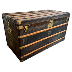 Antico baule da viaggio Goyard in pelle, tela e ottone