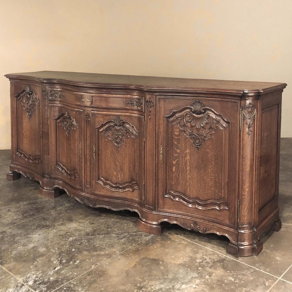 Antique Grand Liegoise Louis XIV Buffet is a magnificent example of the exceptional furnishings that have been created in the region for centuries! Utilizing dense, old-growth oak and inspired by the style in vogue during the reign of Louis XIV, the