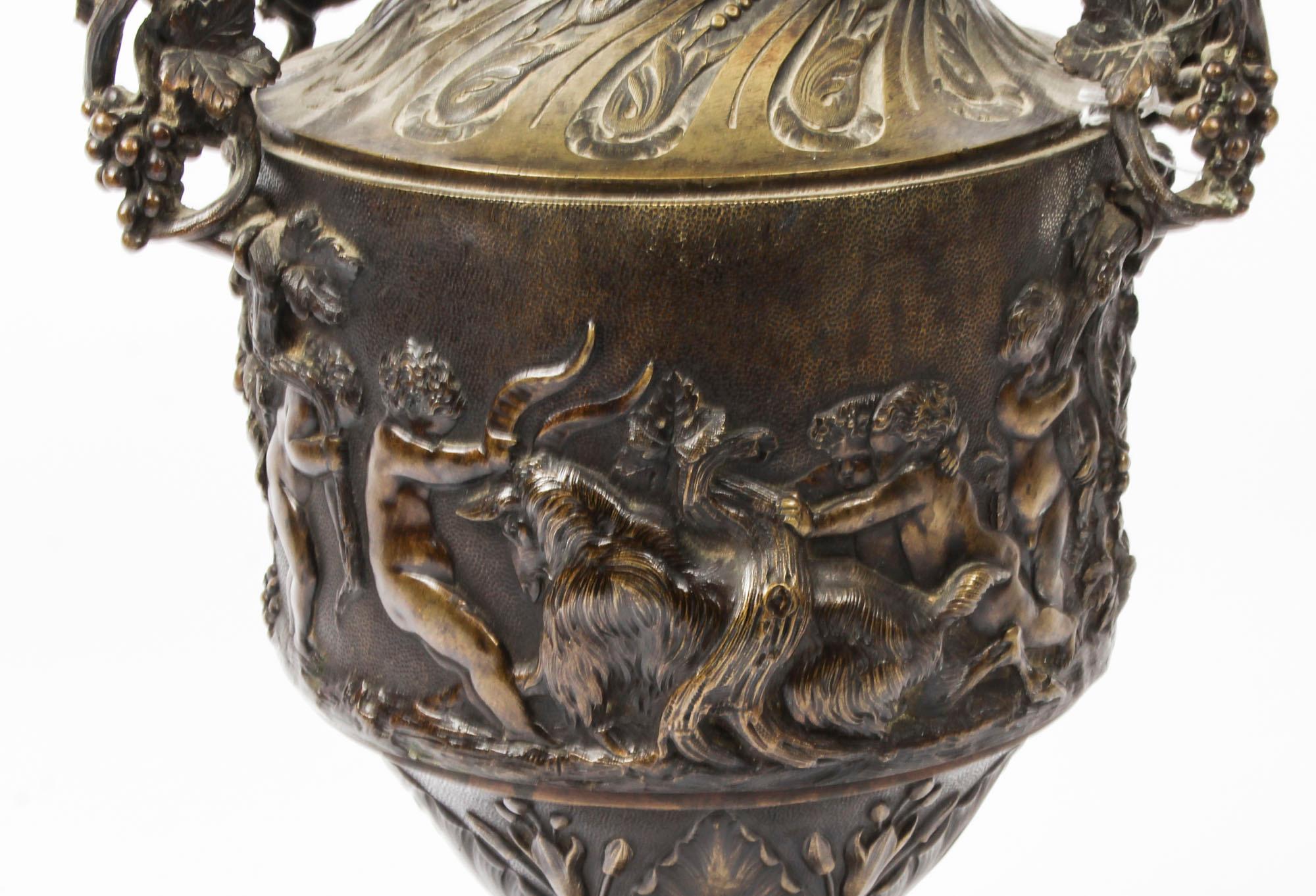 A superb antique French Grand Tour patinated bronze urn, circa 1840 in date.
 
This stunning Renaissance style cast patinated bronze amphora shaped urn. It features a body cast in high relief in the form of grape vines held aloft by putti tha are
