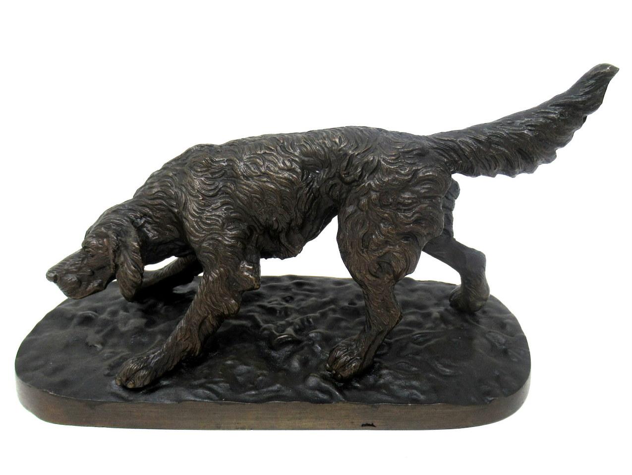 An exceptionally fine quality chisel cast animal patinated bronze of a crouching setter standing on its four legs on a naturalistic oval base, firmly attributed to Pierre Jules Mene. First half of the Nineteenth Century. 

The overall detailing