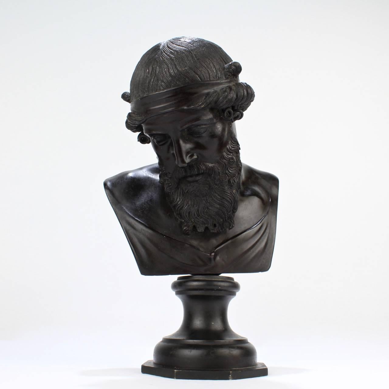 A very good, antique Grand Tour bronze bust of Dionysius.

Modelled after the ancient bust from the Villa of the Papyri at Herculaneum.

The model is occasionally, alternately identified as Plato or Poseidon.

Measures: Height ca. 10 1/2