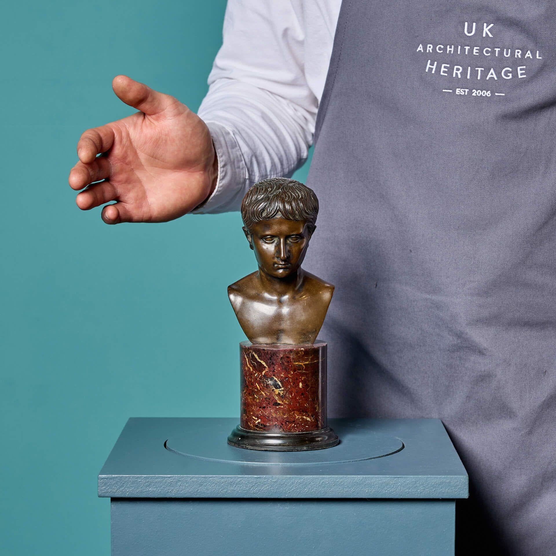 An antique Grand Tour bronze bust of a roman emperor, mounted on a Belgian black marble base.

Thought to be a depiction of a young Caesar, the expertly carved sculpture showcases details of the emperor, from his facial features to the waves in his