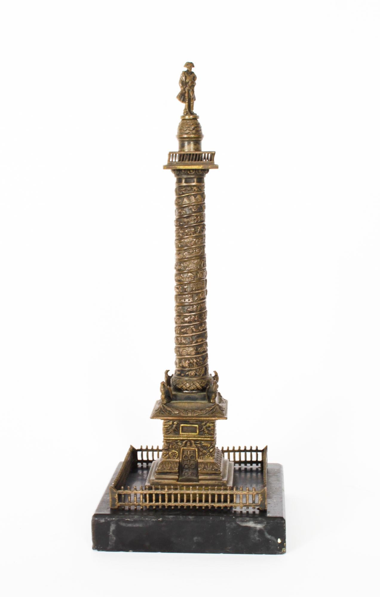 This is a wonderful antique pair of French Grand Tour bronze models of the  Colonne Vendôme and the Luxor Obelisk, circa 1870 in date.
 
This splendid Colonne Vendôme bronze features Napoleon I standing atop in his 'redingote' coat and trademark