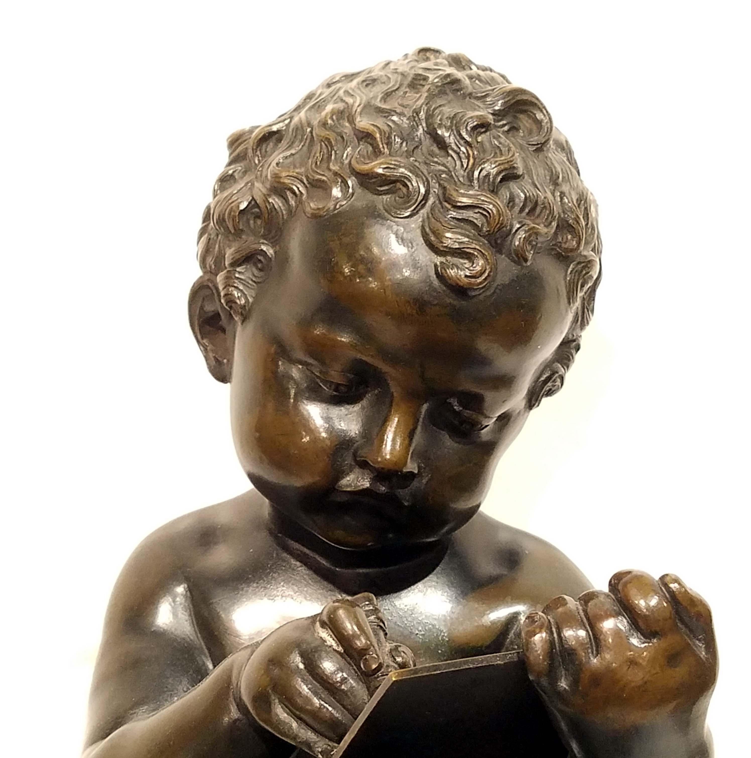 A fine quality cast bronze sculpture of a cherub sitting on a pedestal holding a pen and writing on a tablet. Beautifully patinated in rich brown. Great quality lost wax casting with excellent details. Italian, circa first half of the 19th century.