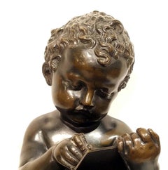 Antique Grand Tour Bronze of a Cherub Writing on a Tablet