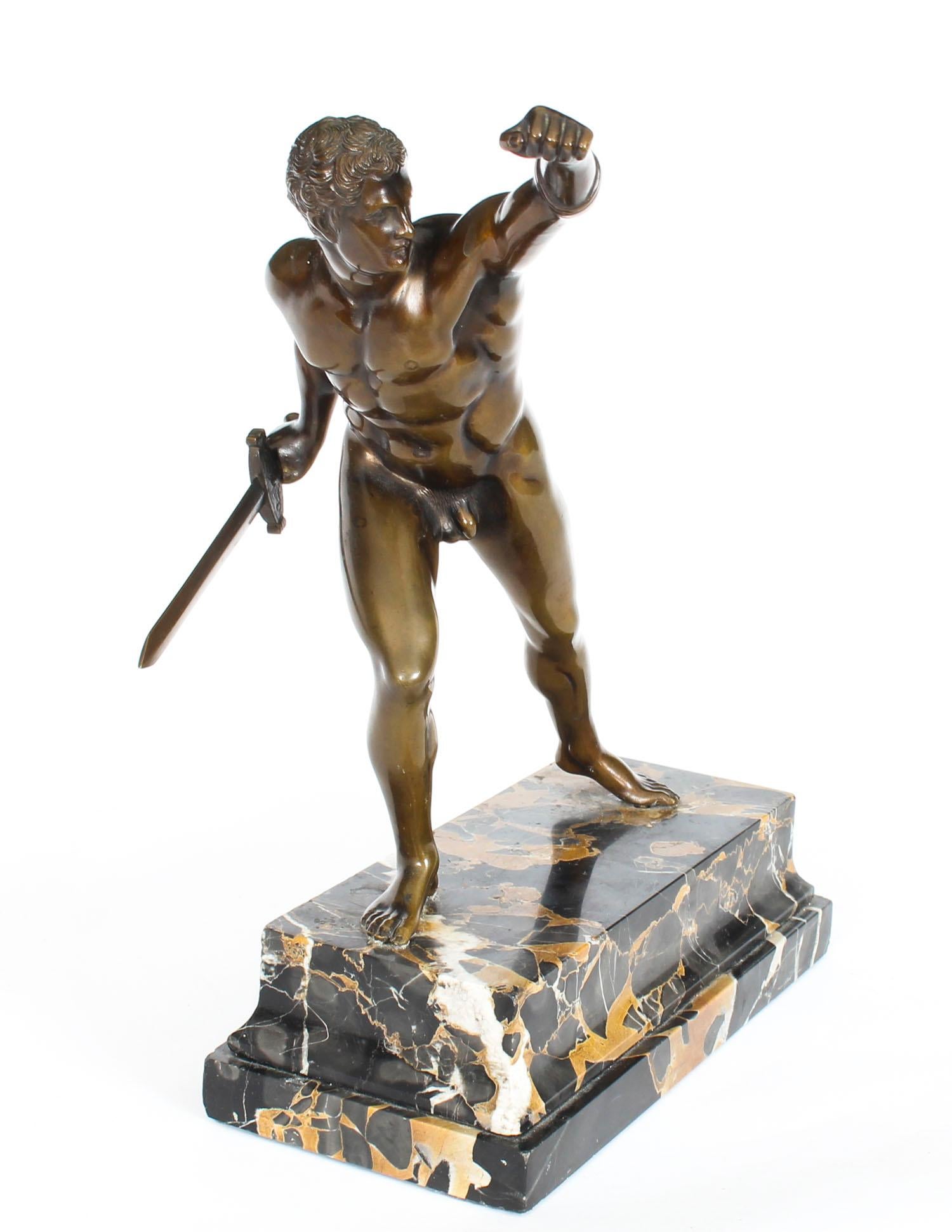 This is a gorgeous bronze statue of a Roman Borghese gladiator dating from circa 1870 in date. 
The attention to detail here is remarkable and this statue has a wonderful golden bronze patina, it is raised on a decorative variegated marble