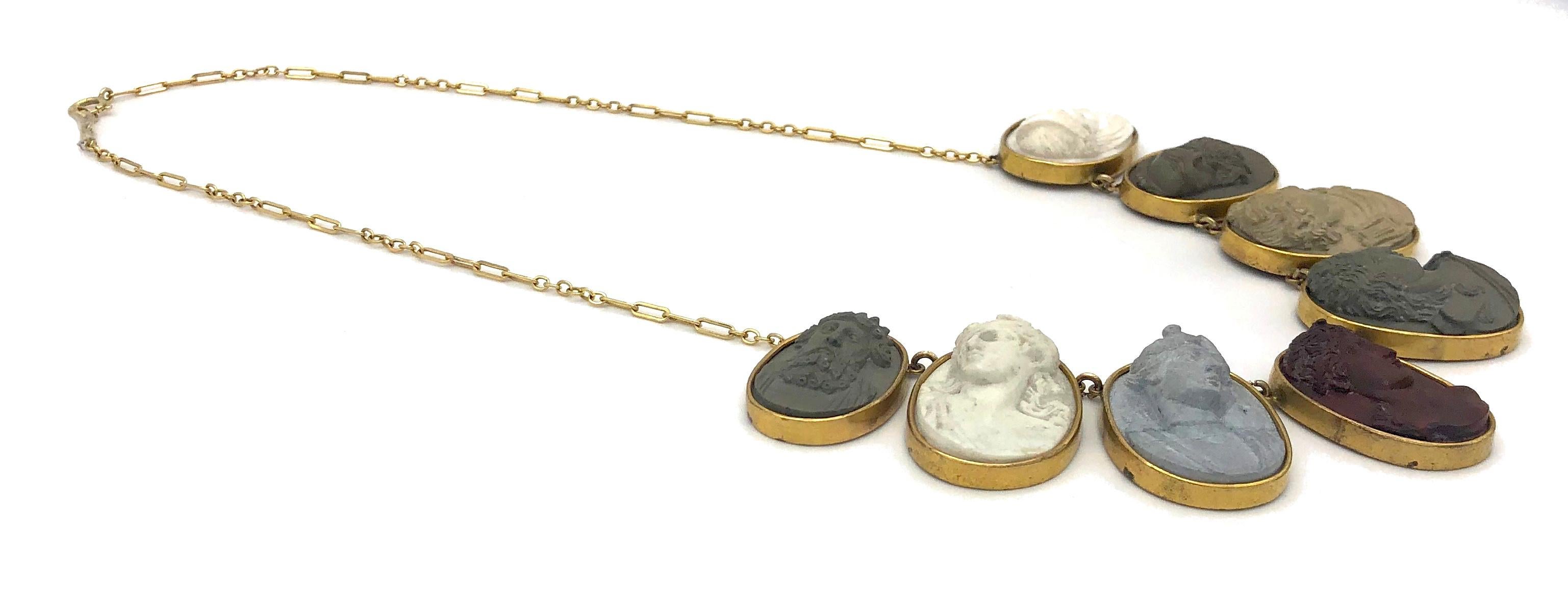 These seven wonderful, particularily large early 19th century oval lava cameos, measuring from 3,5cm x2,6cm to 2,2cm x 3 cm, are  mounted in gilt metal. They have been assembled to make up this magnificent necklace. The later goldchain dates from