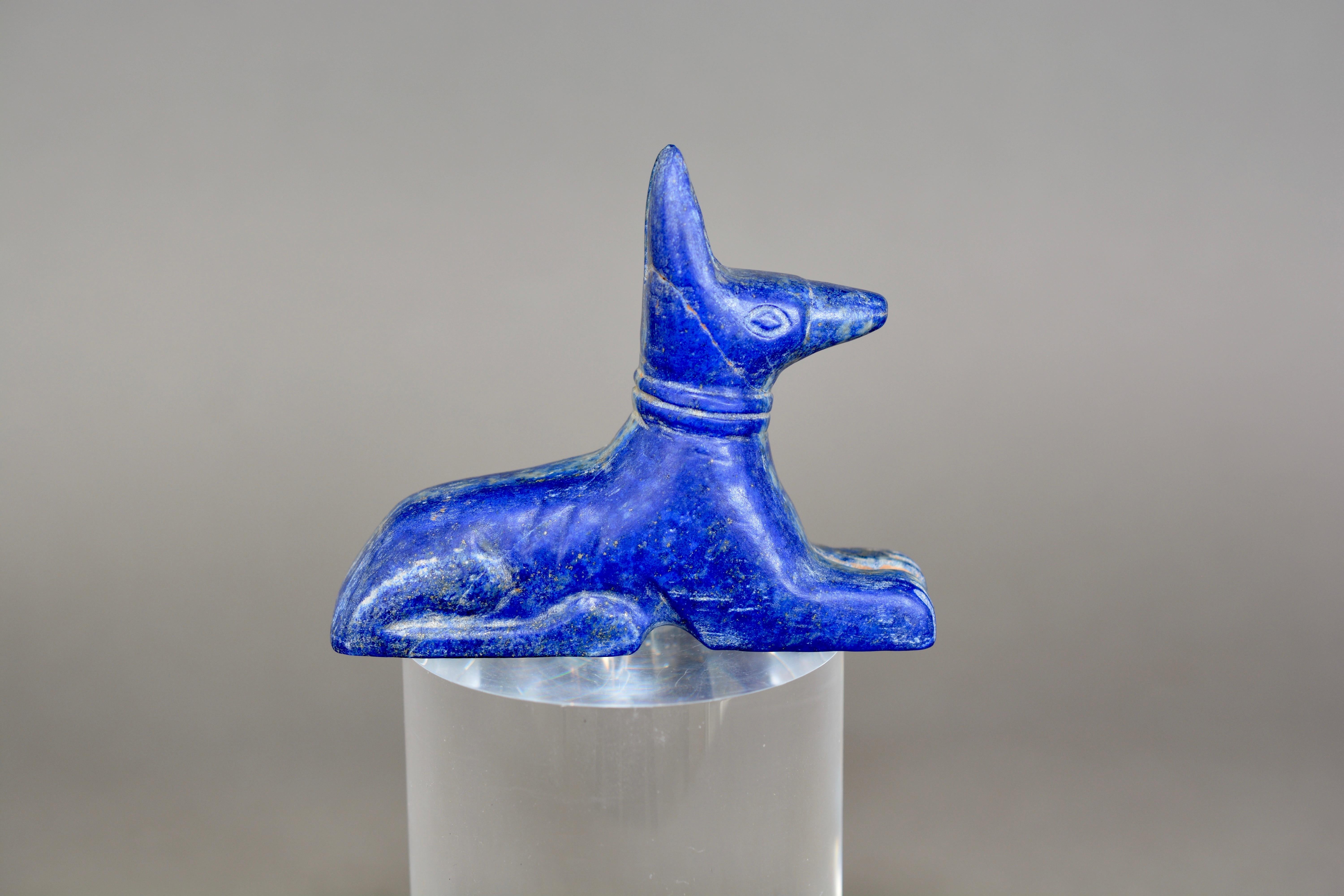 A good antique grand tour Anubis figure. Hand carved from the semi precious stone Lapis Lazuli and dating from circa.1900-1920. A wonderful tactile object. Measures: 8.7cms long, 2.5cms wide and 7cms tall.

Anubis, also called Anpu, ancient