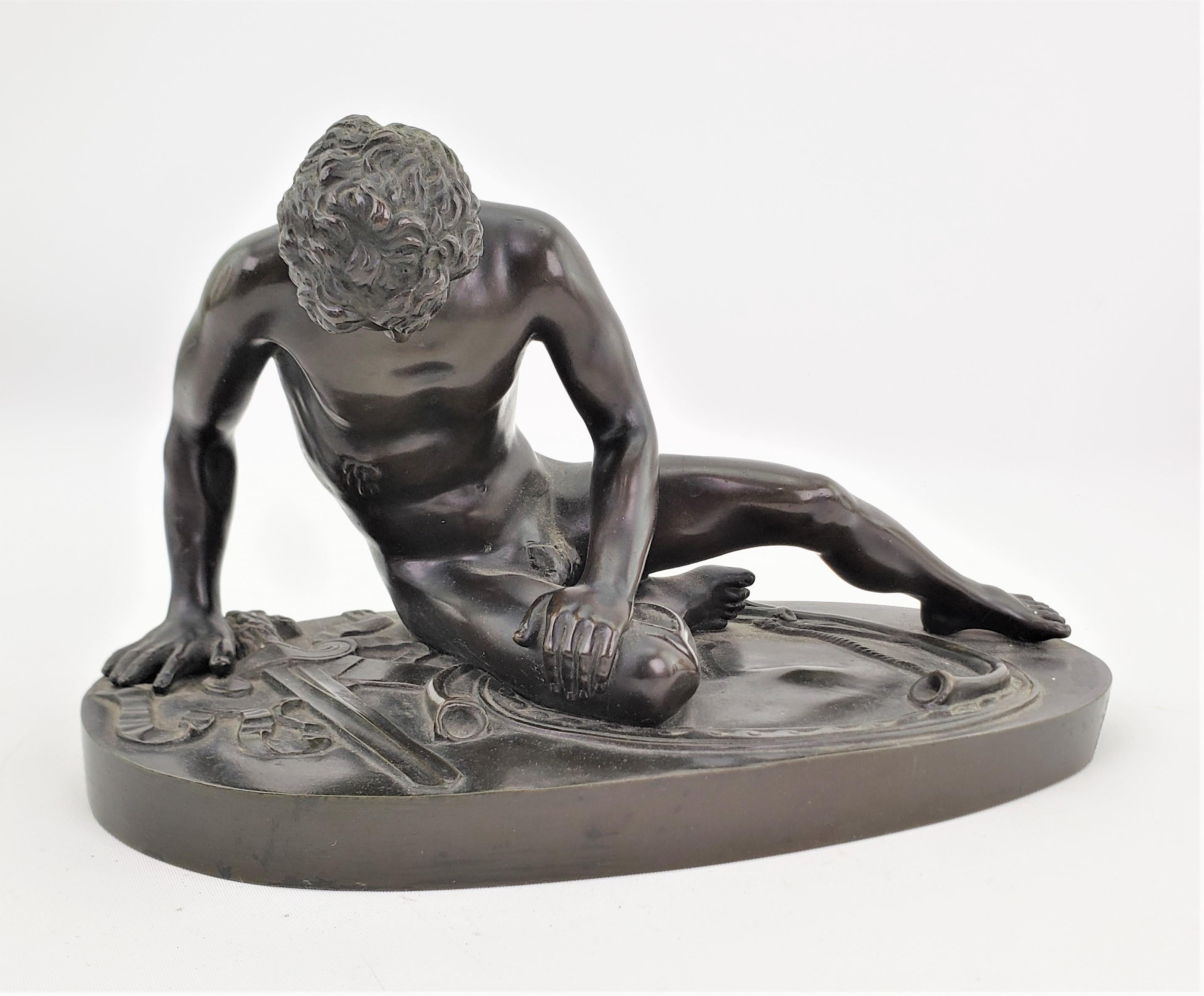 This very ornately cast bronze sculpture is unsigned, but presumed to have been done in Italy in approximately 1900, in the Classical Roman style. This figurative study depicts the famous Classical Roman sculpture known as 'The Dying Gaul' and was