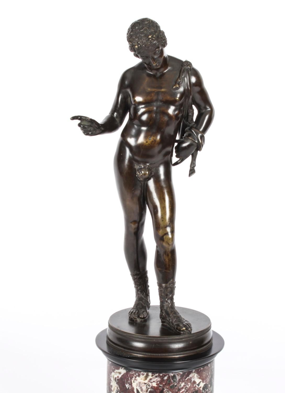 This is a superb large antique Grand Tour patinated bronze version of David, dating from the mid 19th Century.
 
The bronze statue depicts David with an enigmatic smile posed with one foot forward.
The youth is completely naked, apart from boots